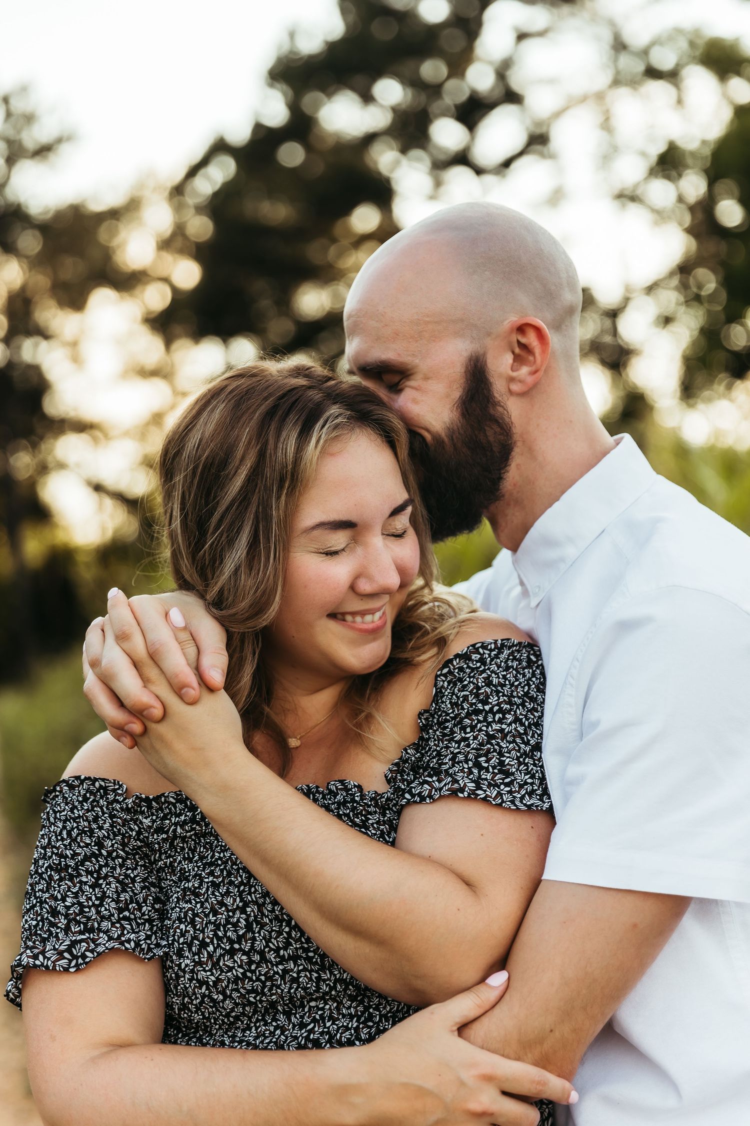 A couple shares intimate moments in a series of romantic sunset photos showing tender embraces and joyful laughter.