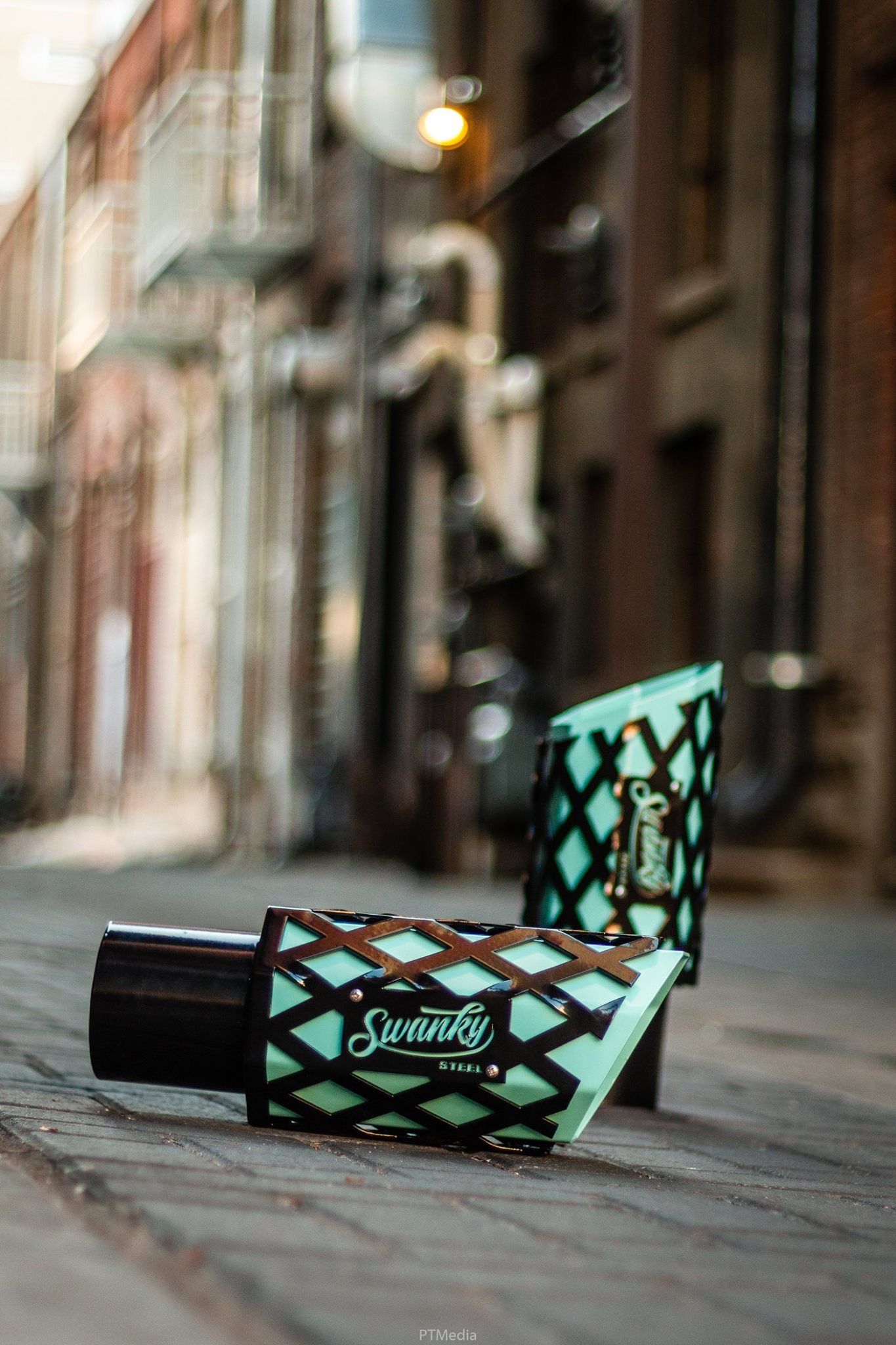 A turquoise and black wallet shown from different angles on a wooden surface in multiple product photos.