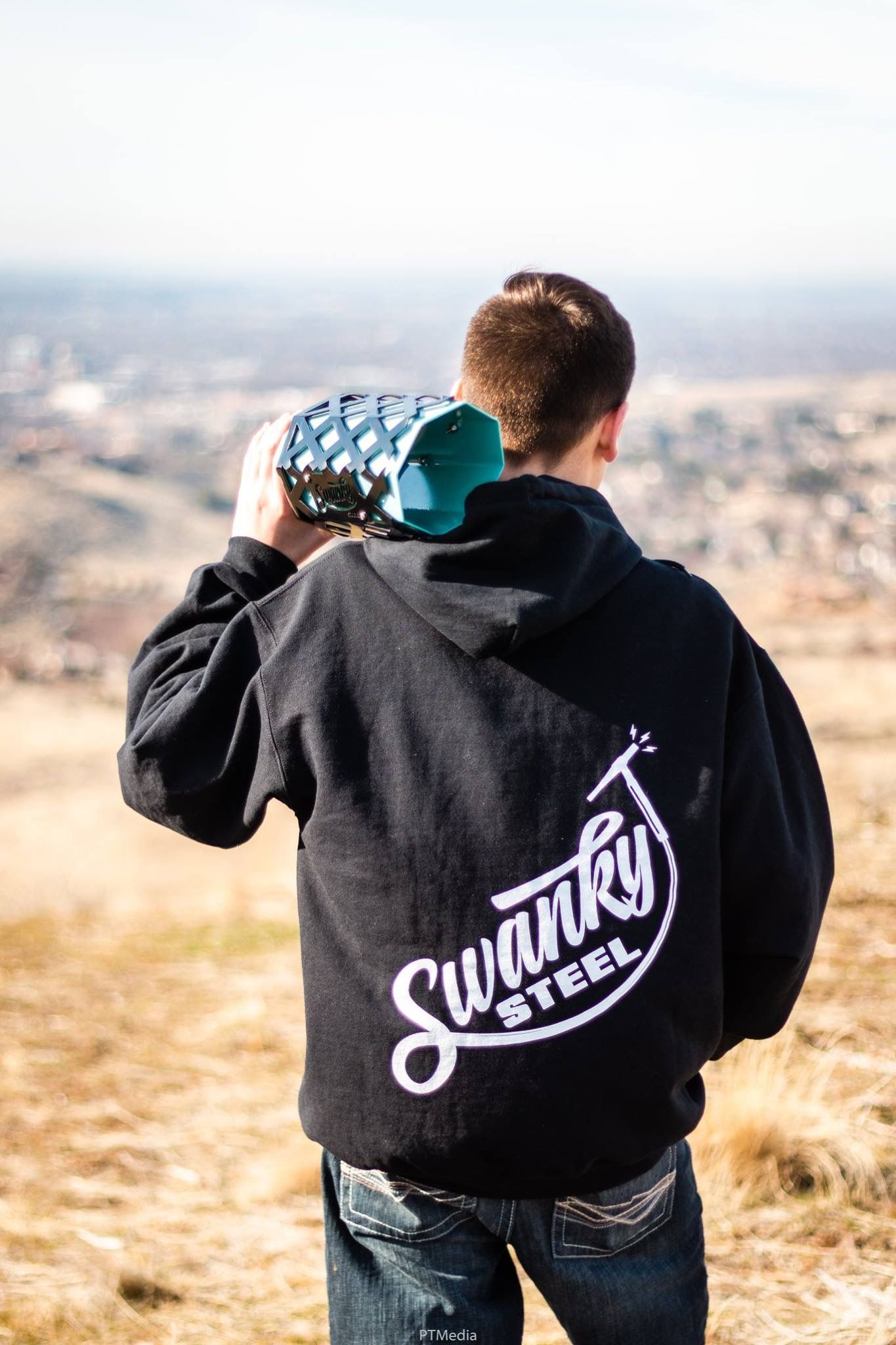 A person wearing a black hoodie with 