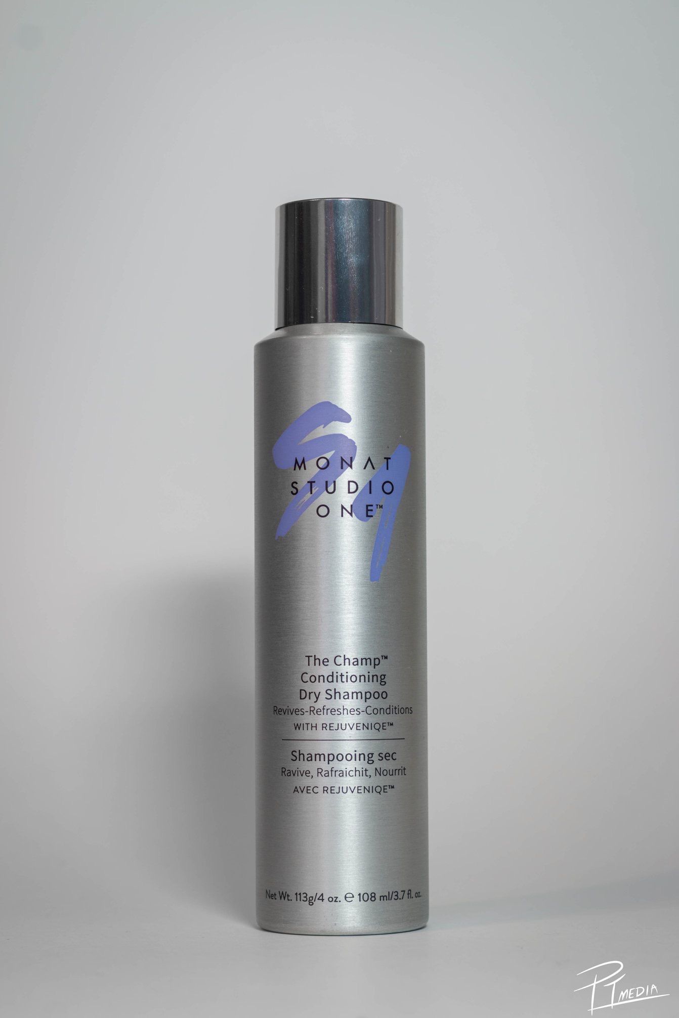 Multiple views of a silver Monat Studio hair care product bottle with blue text against a white background.
