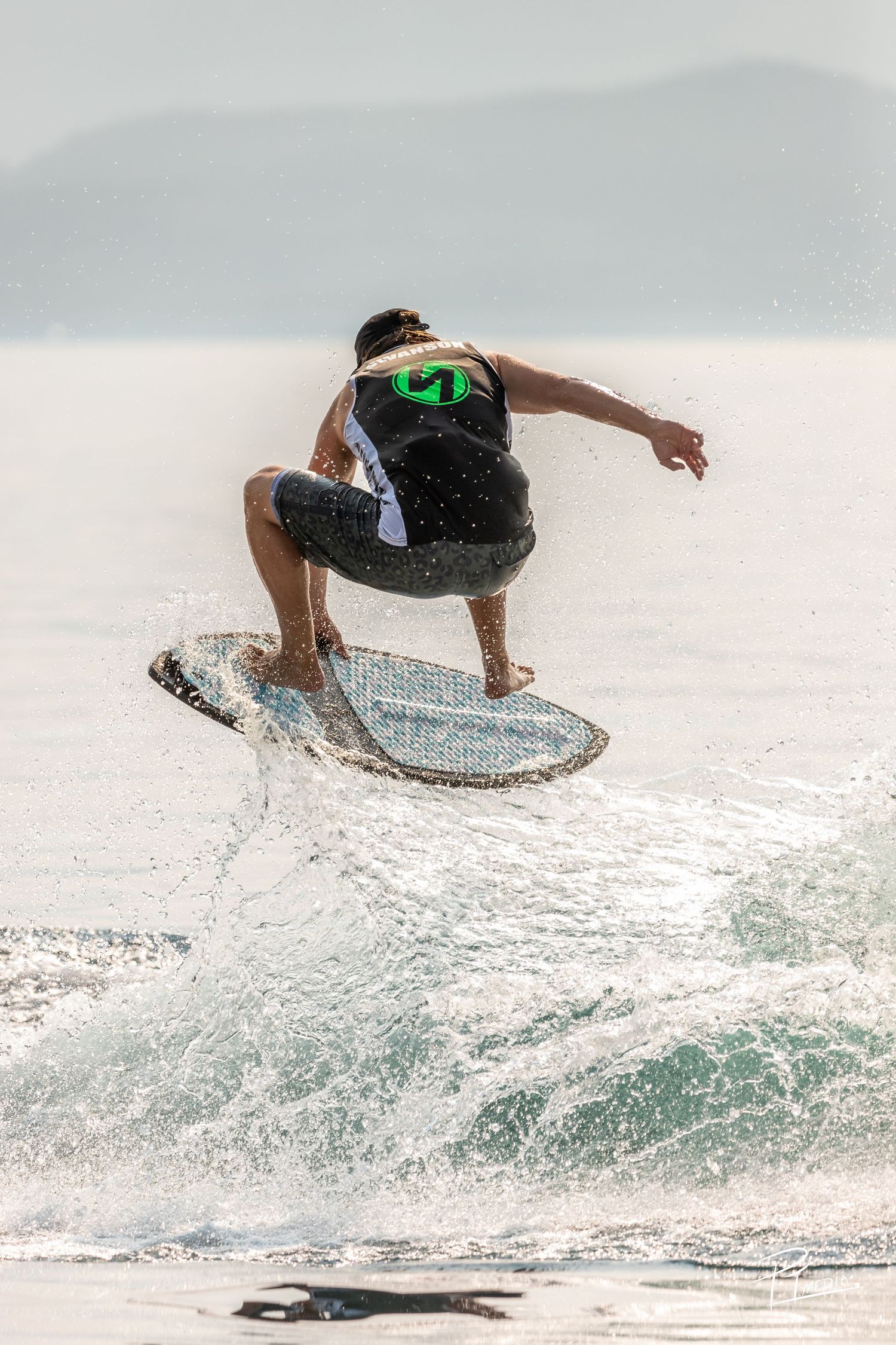 A surfer performs an aerial maneuver sequence over a breaking wave, demonstrating progressive stages of a dynamic trick.