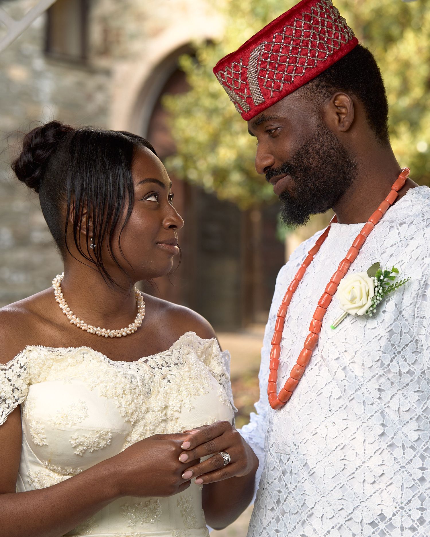 Bride and groom looking at each other during a romantic outdoor wedding portrait.