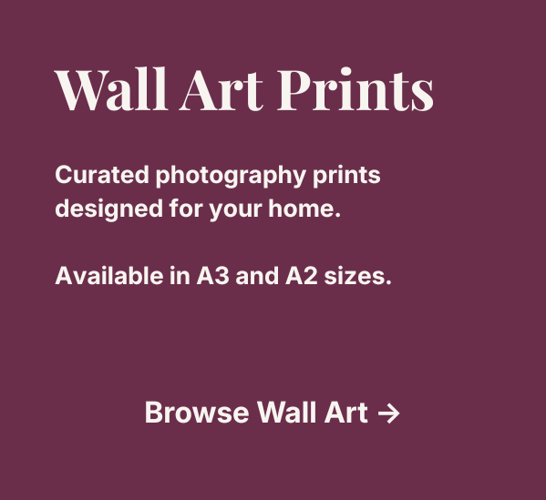 Wall art prints advertisement offering curated photography prints for home decor, available in A3 and A2 sizes on a burgundy background.