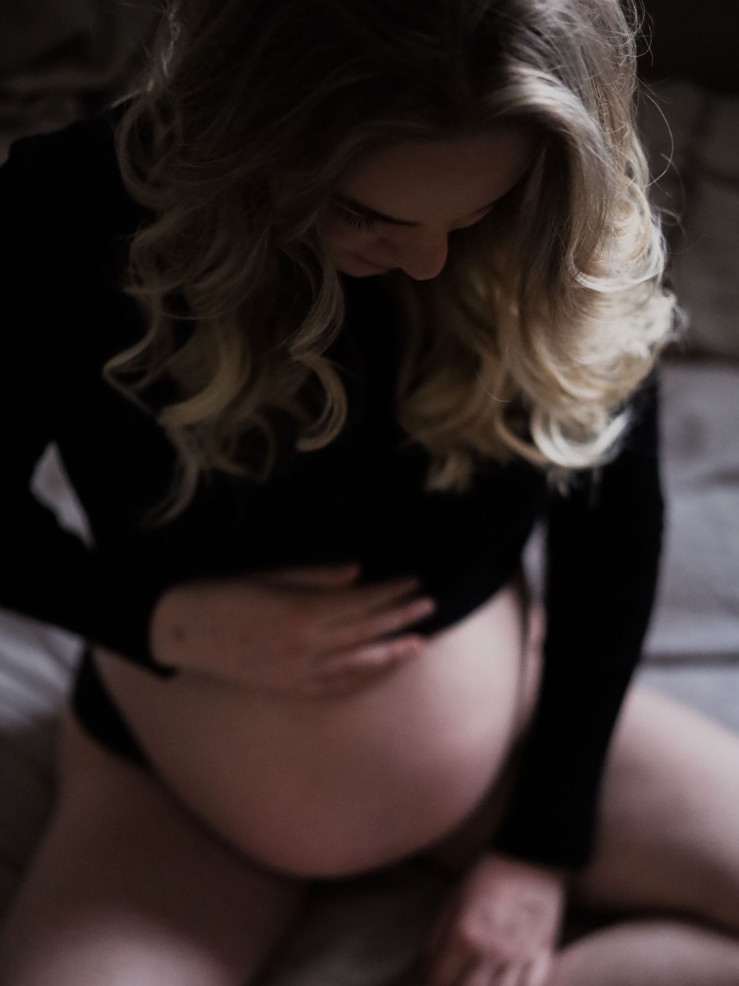 Intimate black and white maternity boudoir photography.