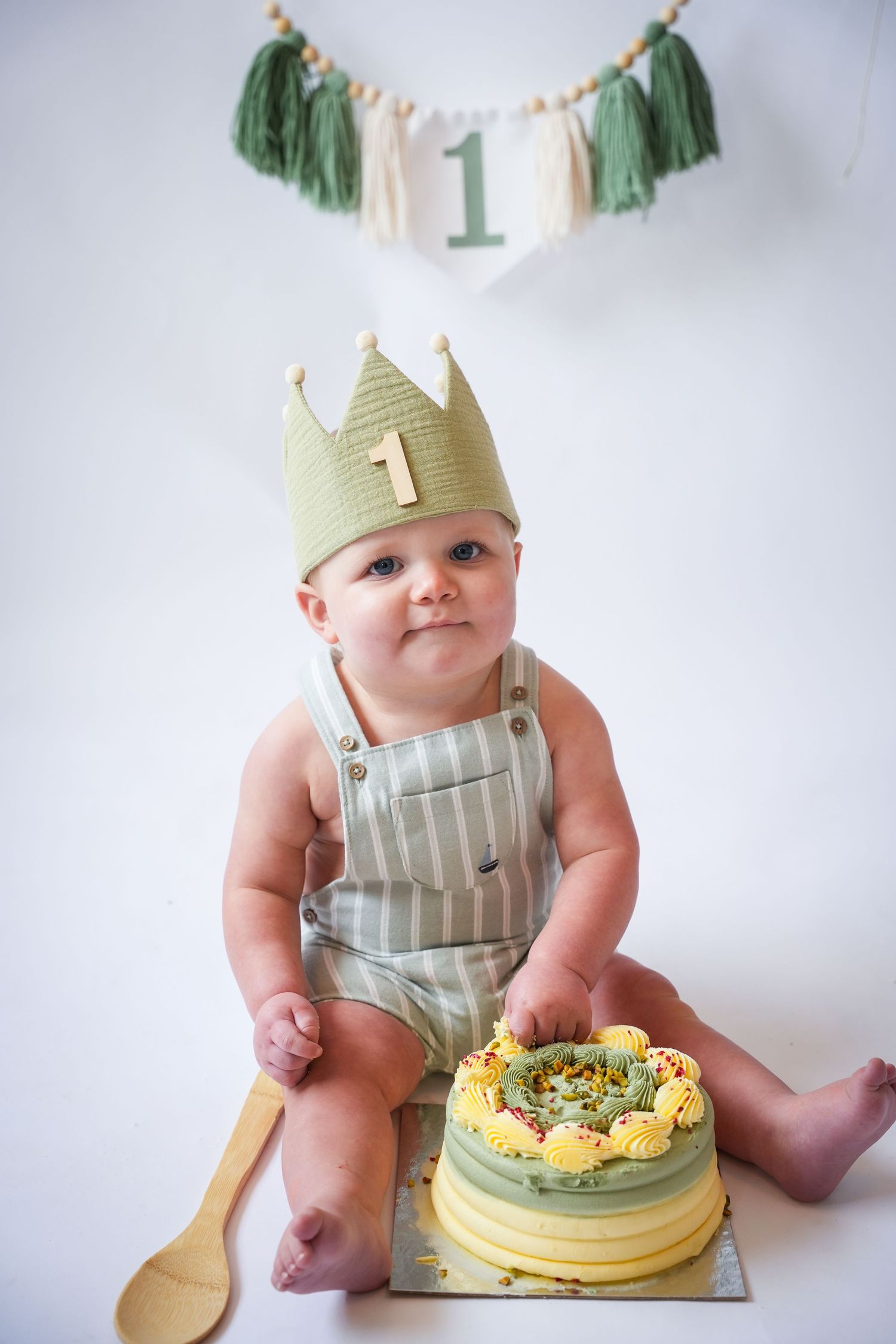 Photo of baby with cake, light, airy background with natural lighting