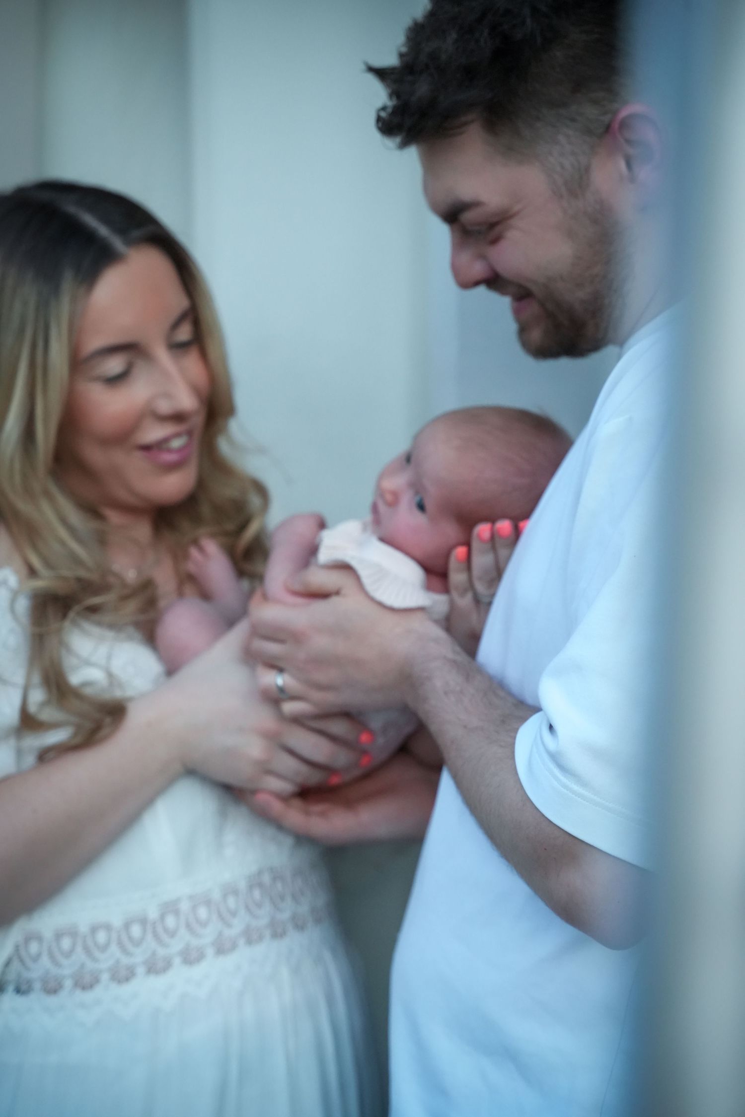 Photo of mum and baby, light, airy background with natural lighting