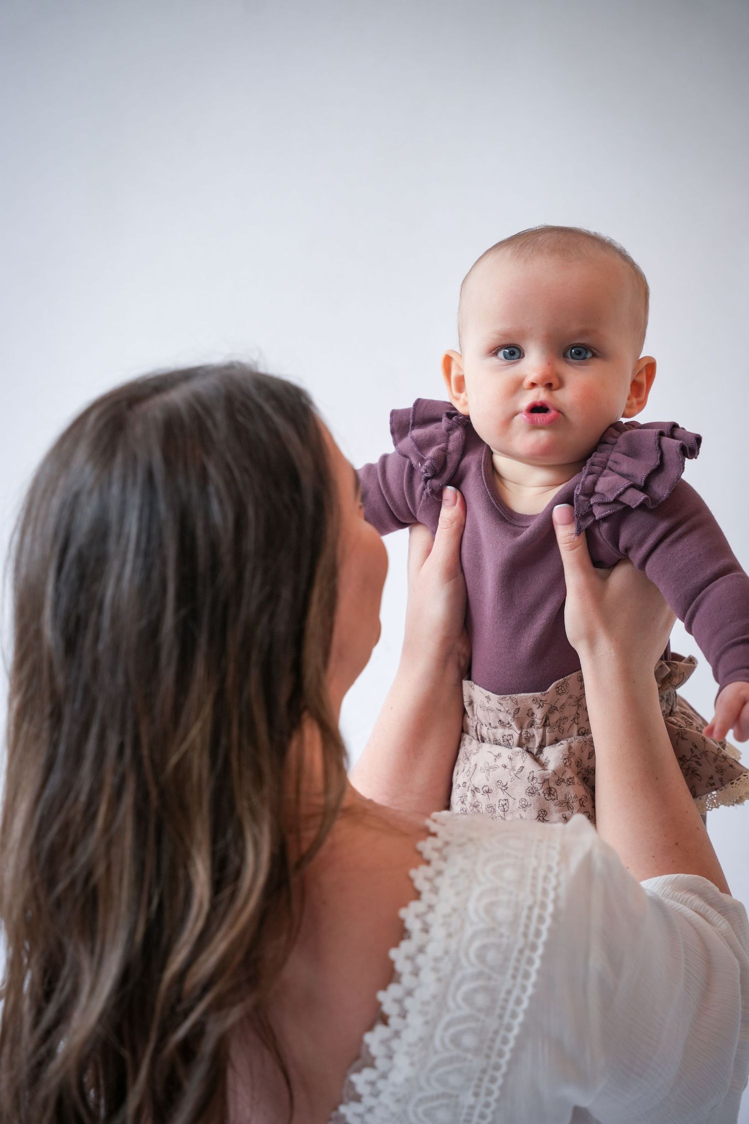 Photo of mum and baby, light, airy background with natural lighting