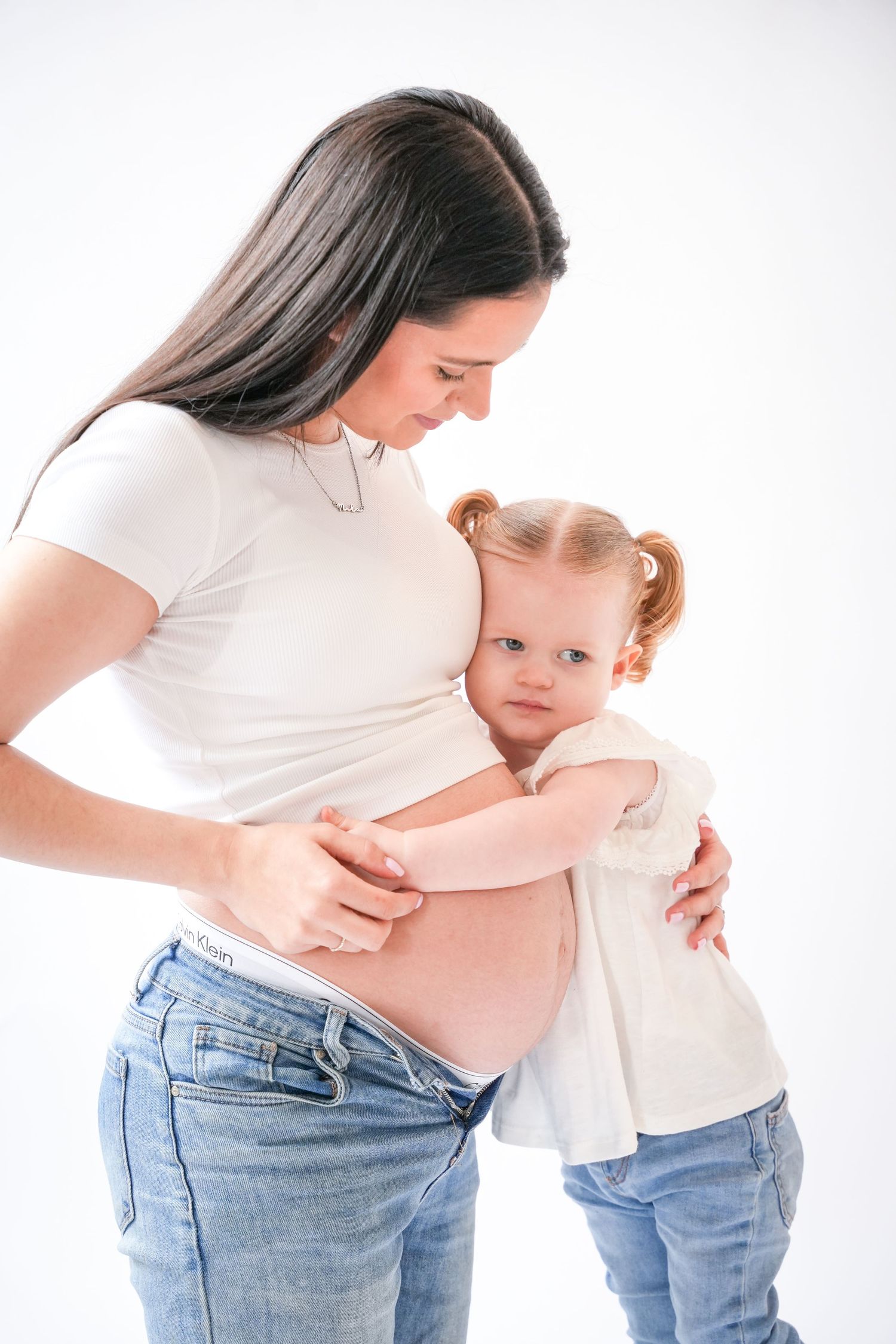 Photo of mum and toddler, light, airy background with natural lighting