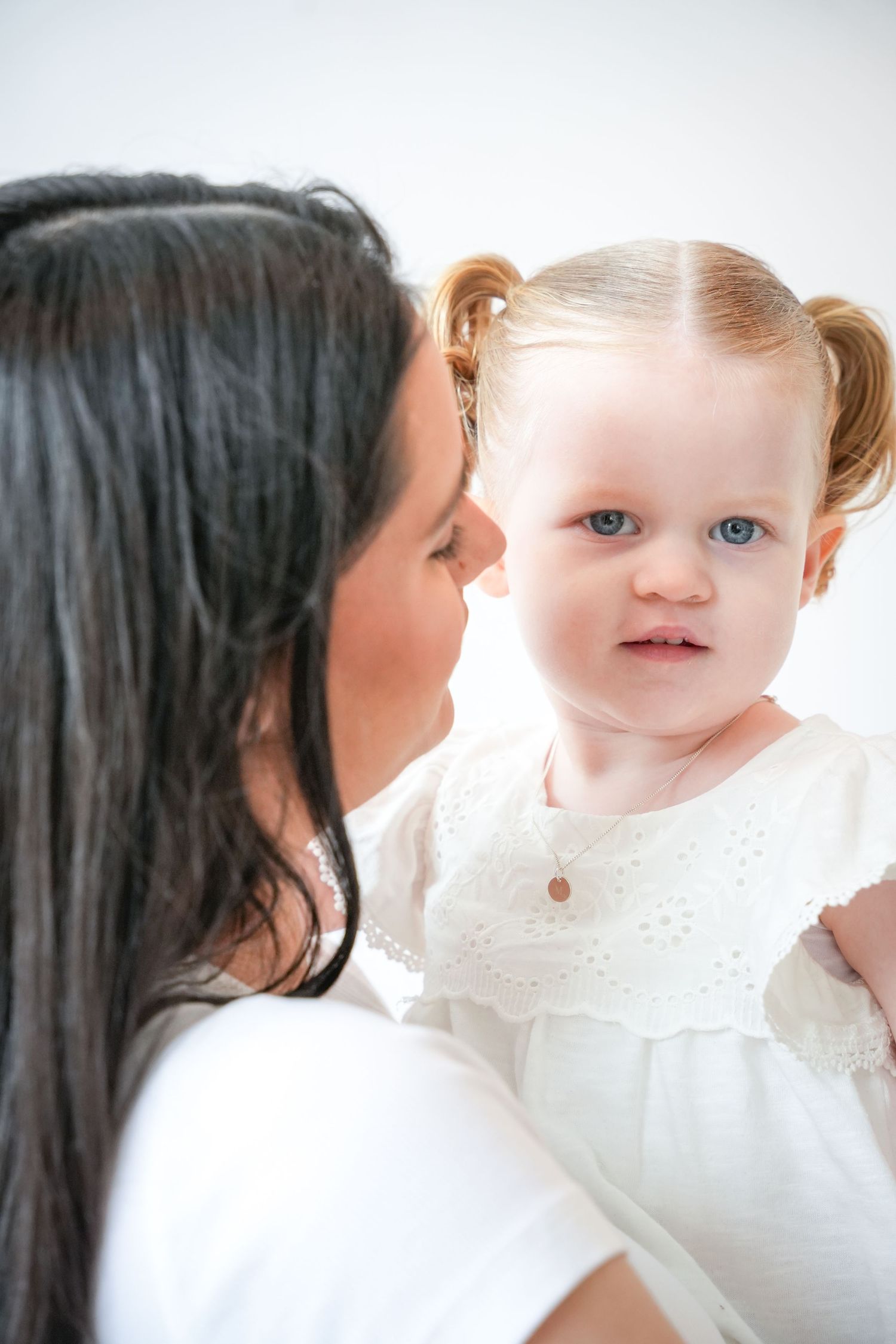 Photo of mum and baby, light, airy background with natural lighting