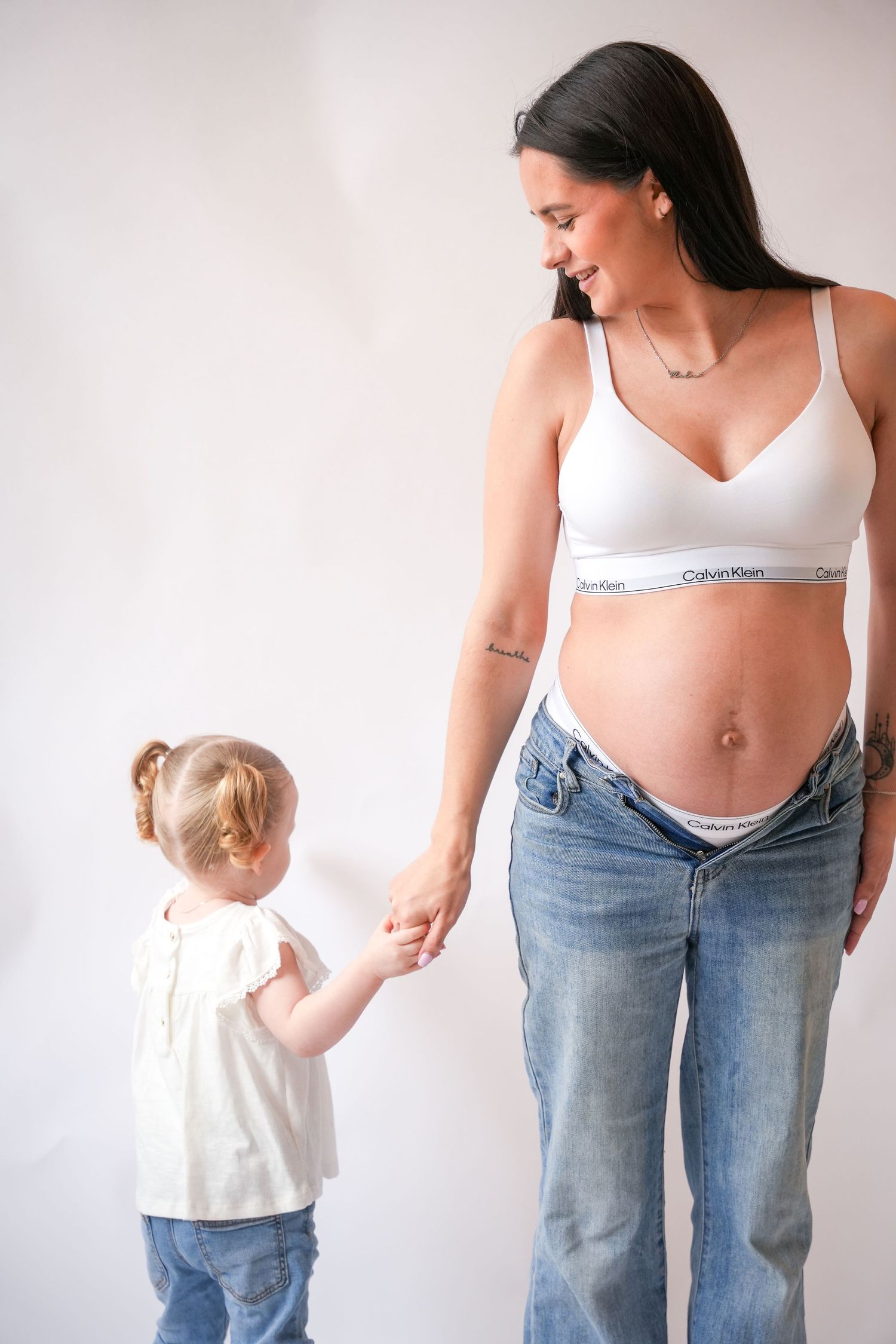 Photo of mum and baby, light, airy background with natural lighting