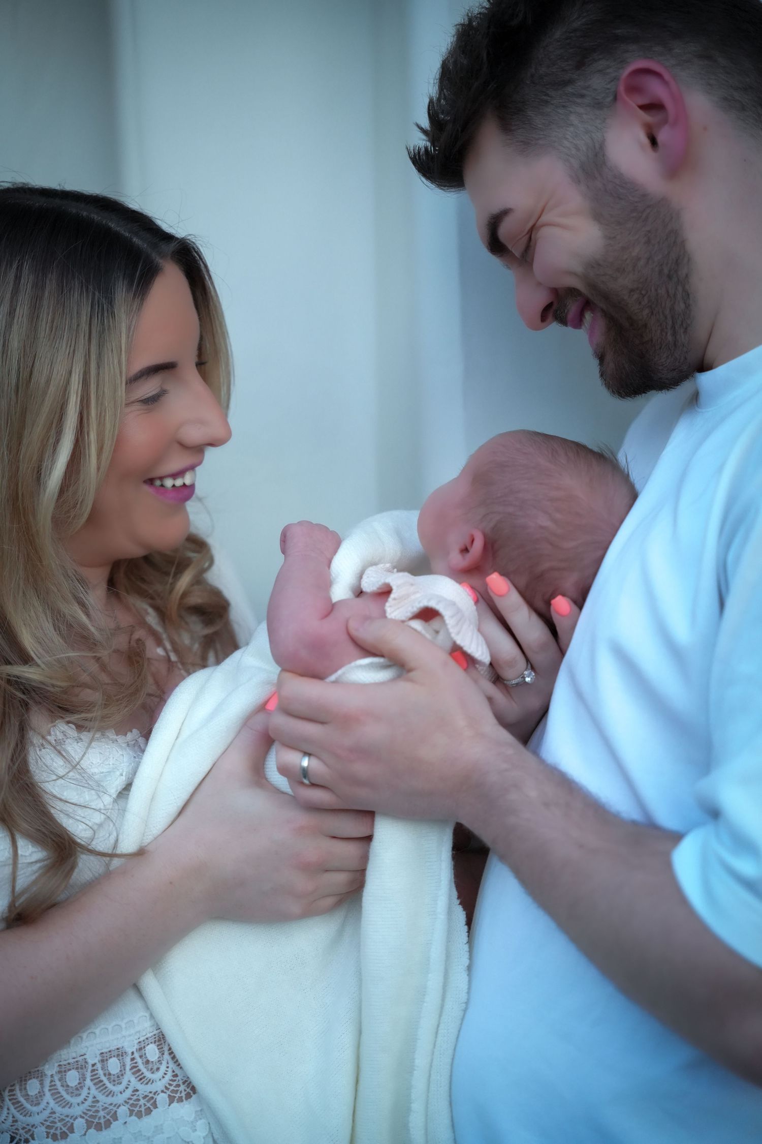 Photo of mum and baby, light, airy background with natural lighting