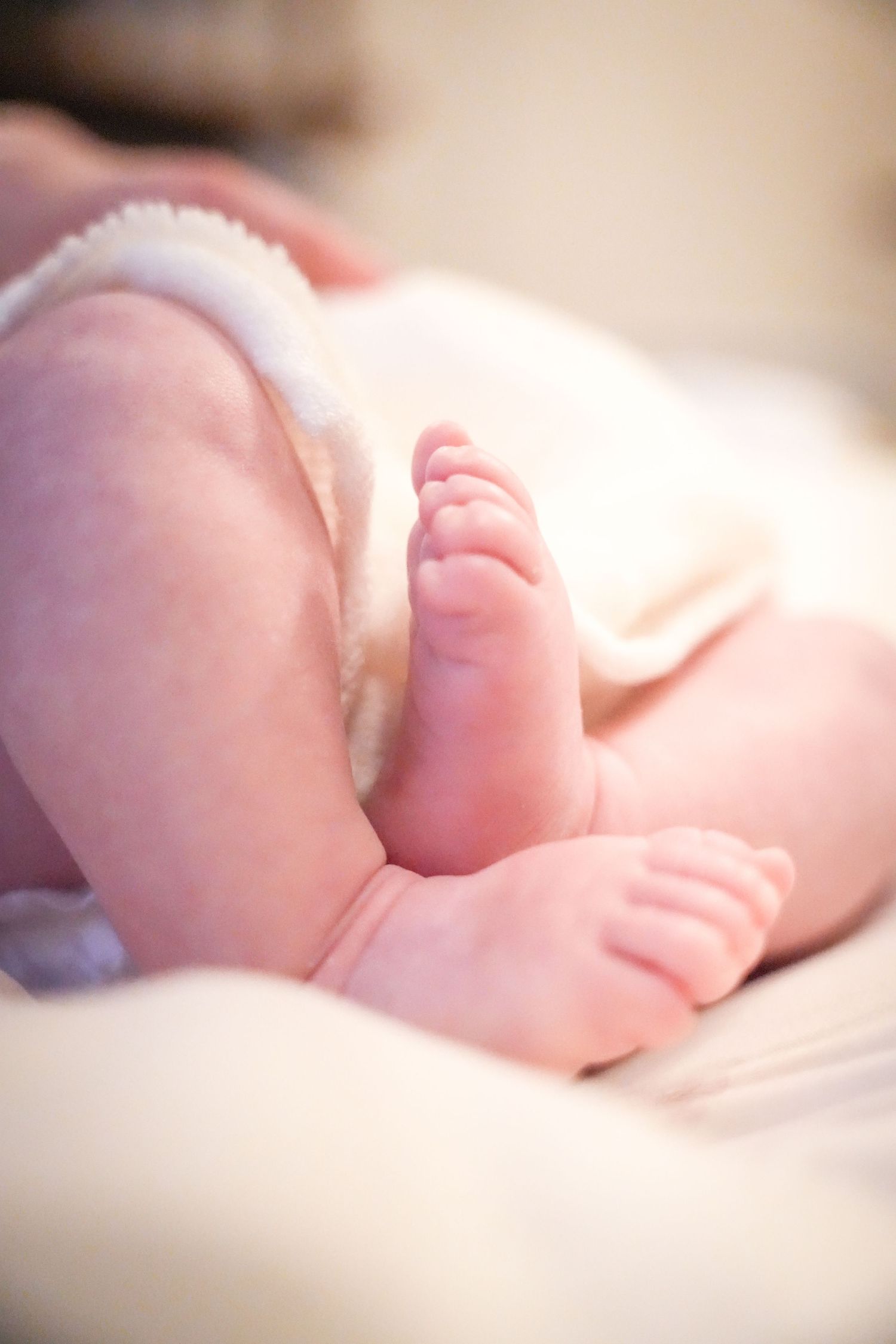 Photo of babies feet, light, airy background with natural lighting