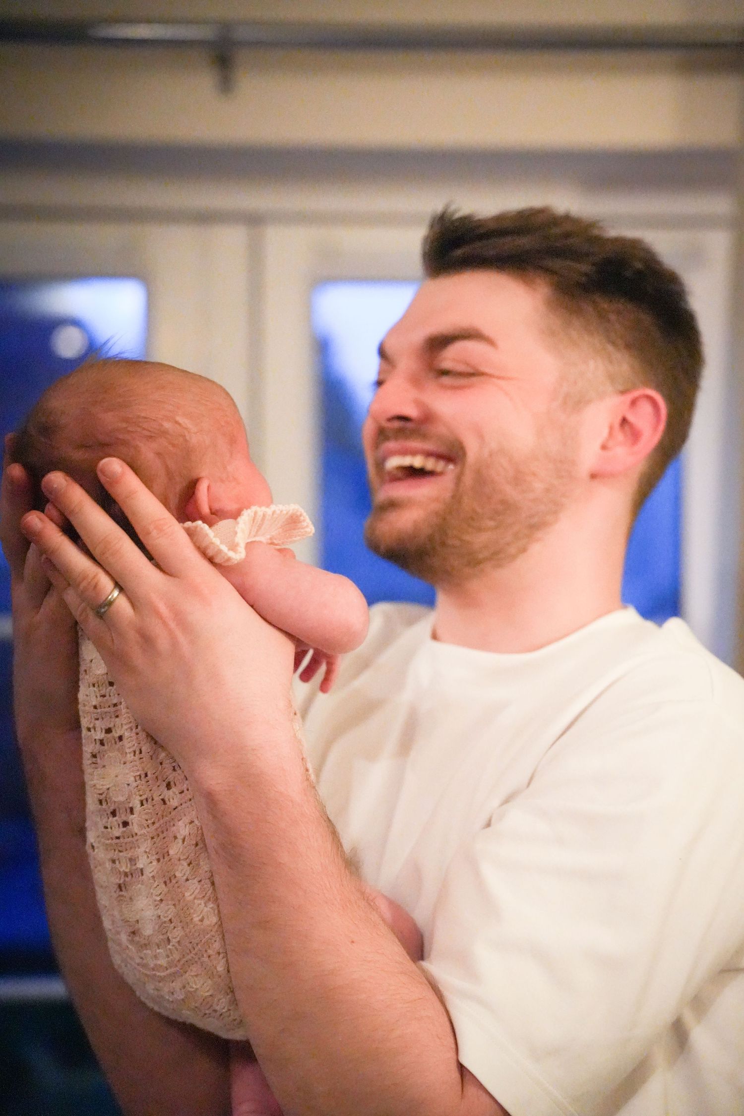 Photo of Dad and baby, light, airy background with natural lighting