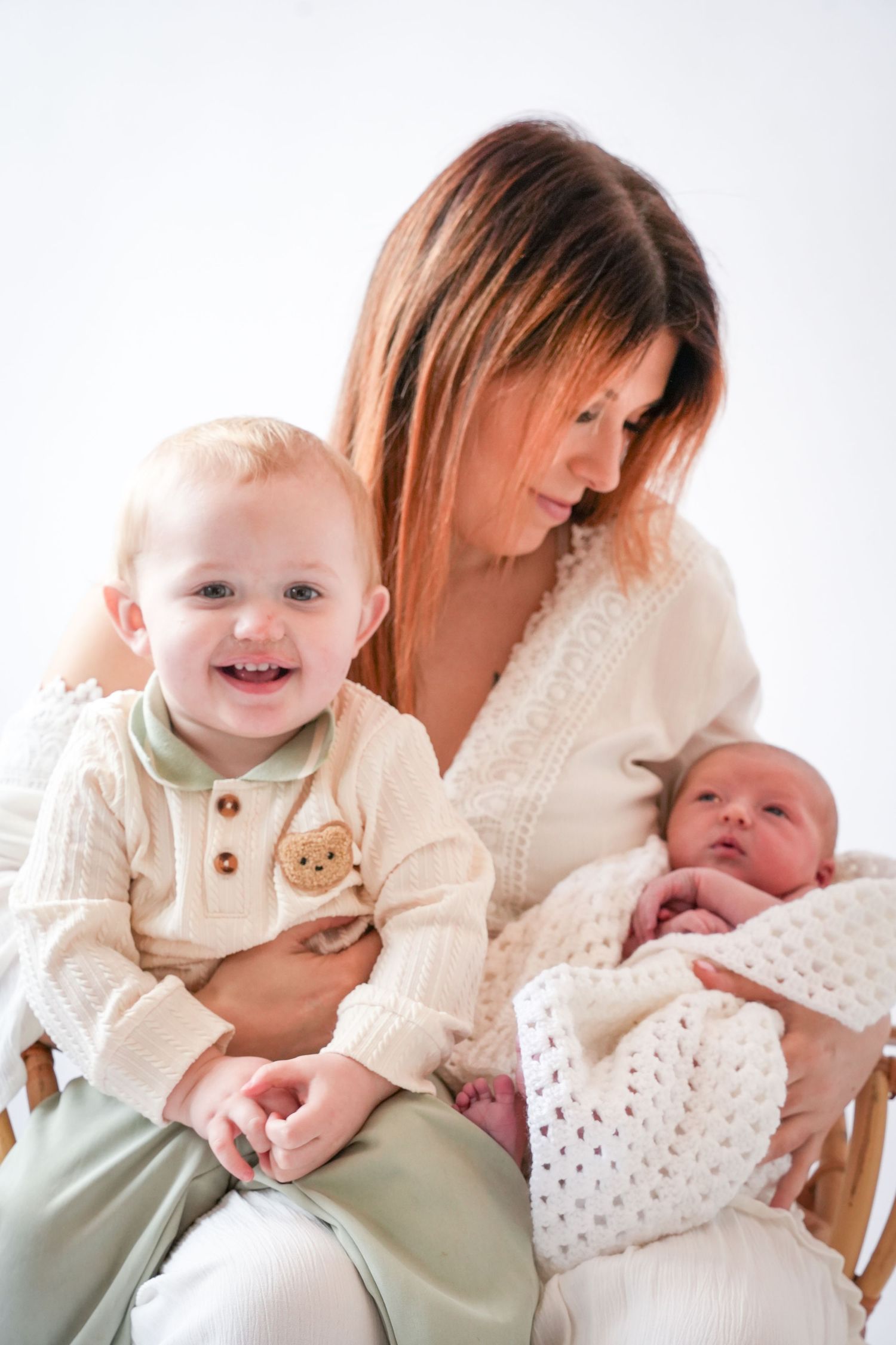 Photo of mum and baby and toddler, light, airy background with natural lighting