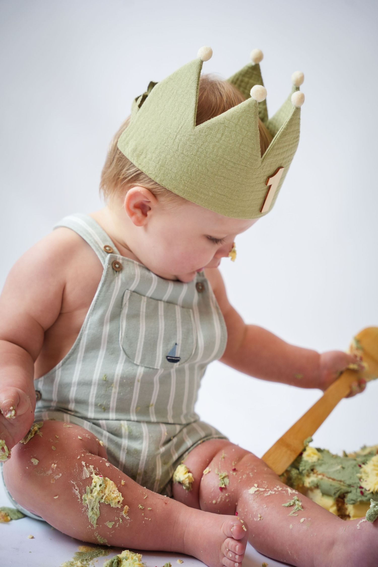 Photo of baby with cake, light, airy background with natural lighting