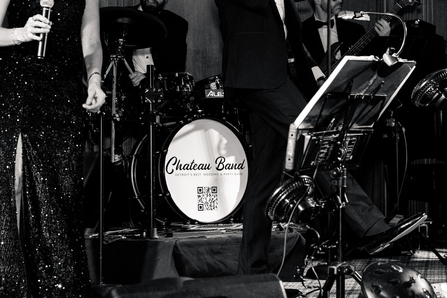 Black and white photo of Chateau Band performing live at an elegant wedding reception.