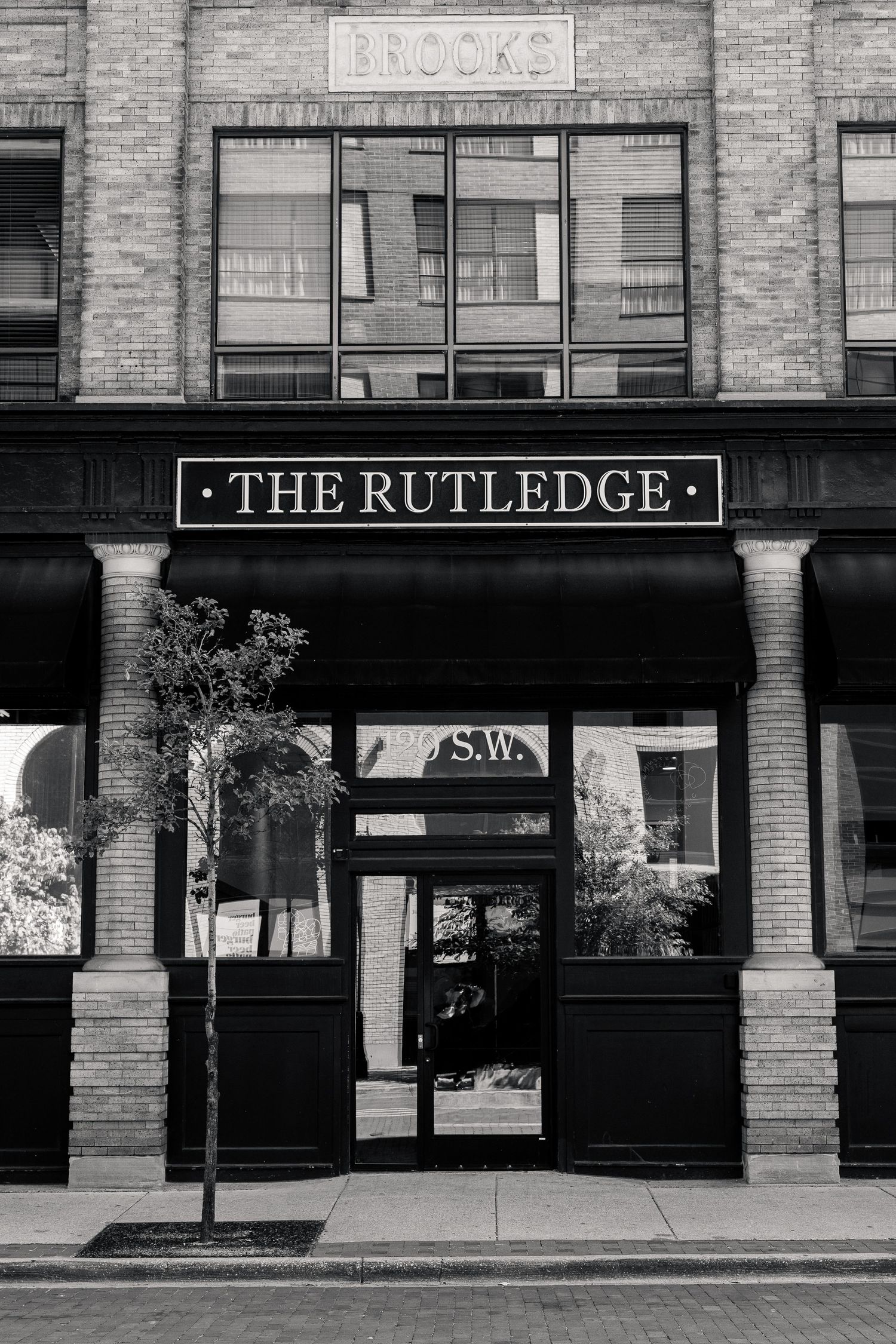 Black and white photo of The Rutledge venue entrance with Brooks building facade in Nashville.