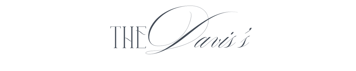 Elegant script logo reading The Davis's in silver calligraphy on white background.