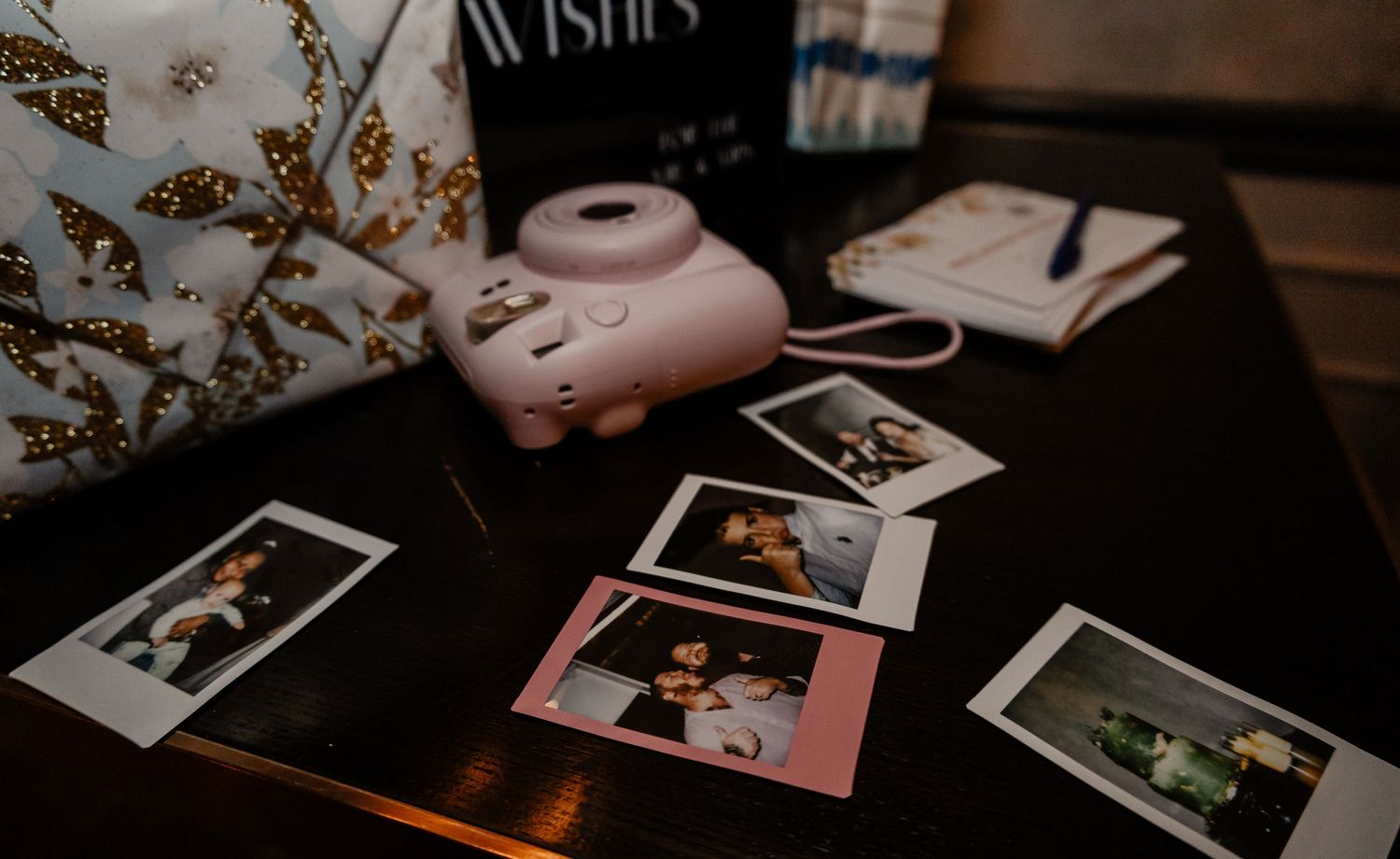 table full of polaroids from the night