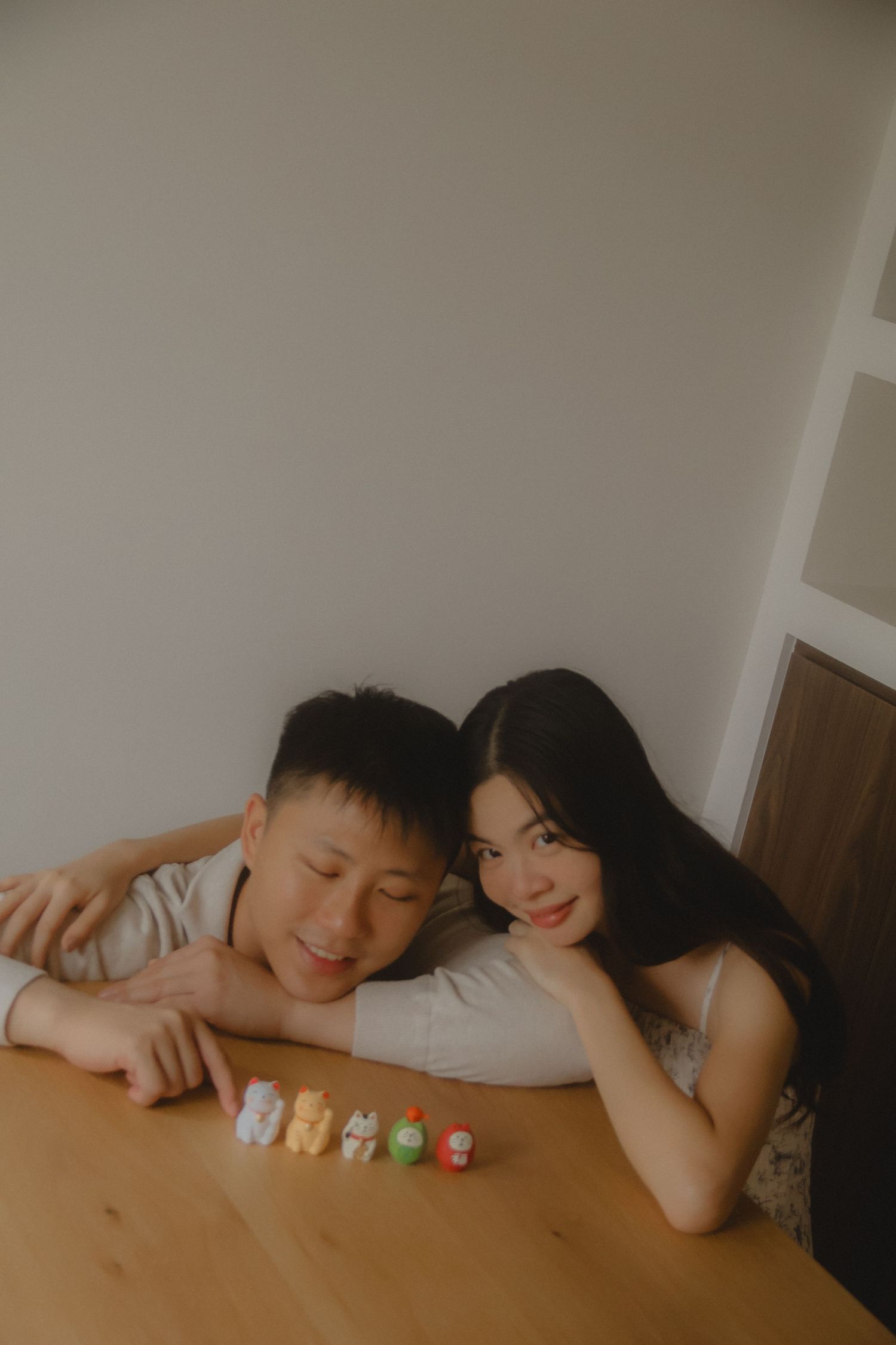 In-home couple photoshoot in Singapore with warm, natural light and storytelling focus