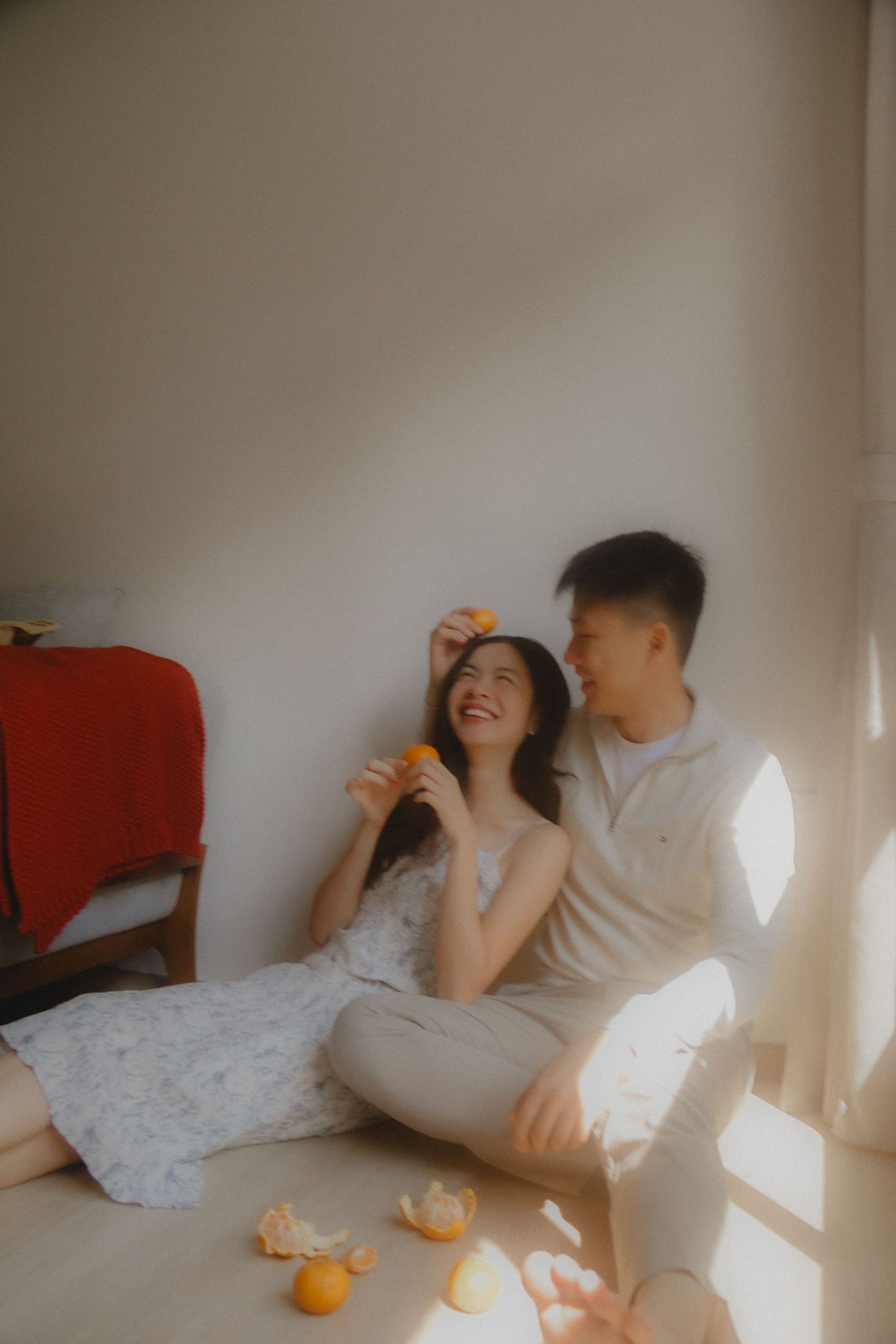 In-home couple photoshoot in Singapore with warm, natural light and storytelling focus