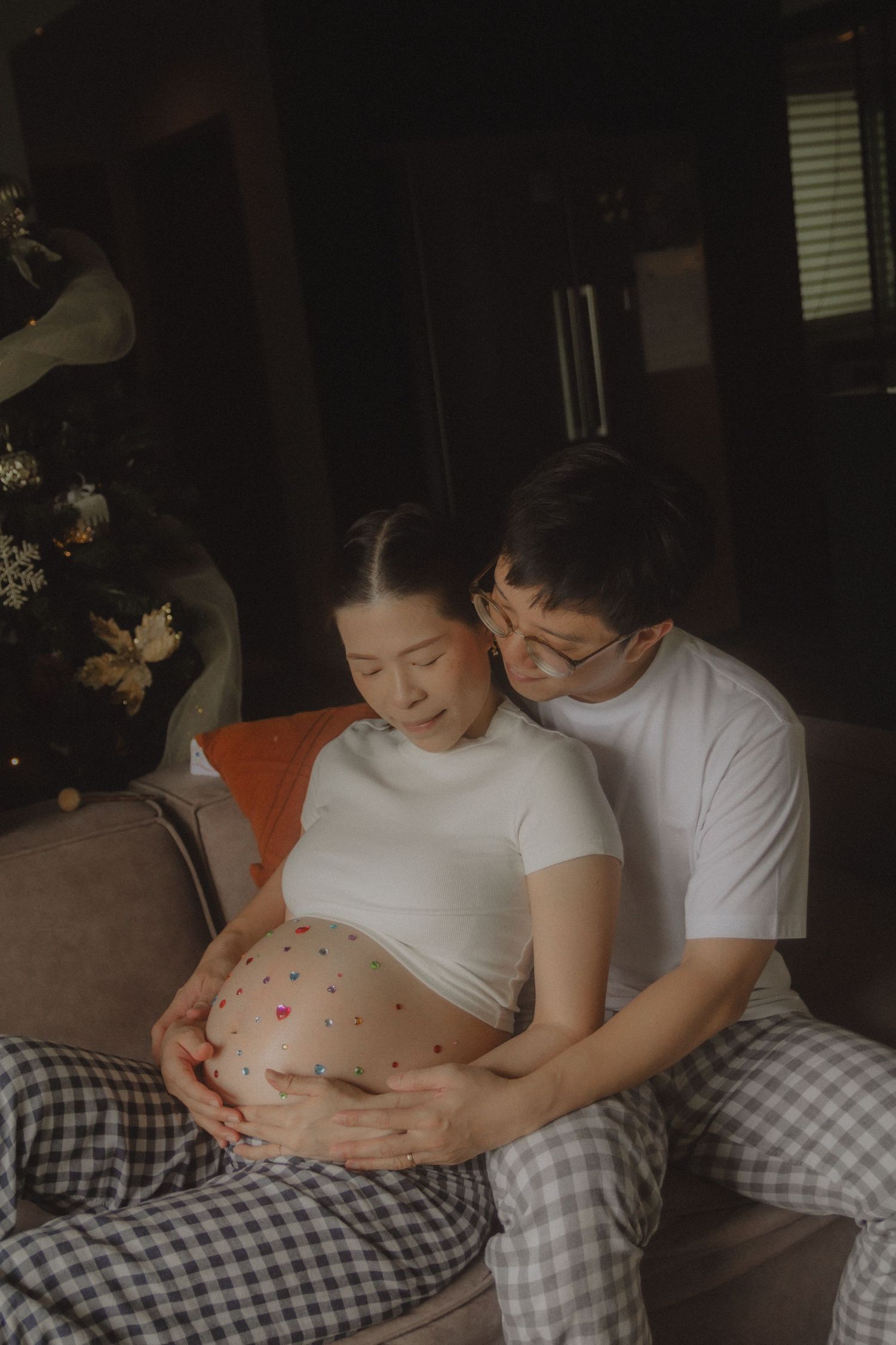 in-home maternity portrait photography in Singapore with natural light and emotional storytelling