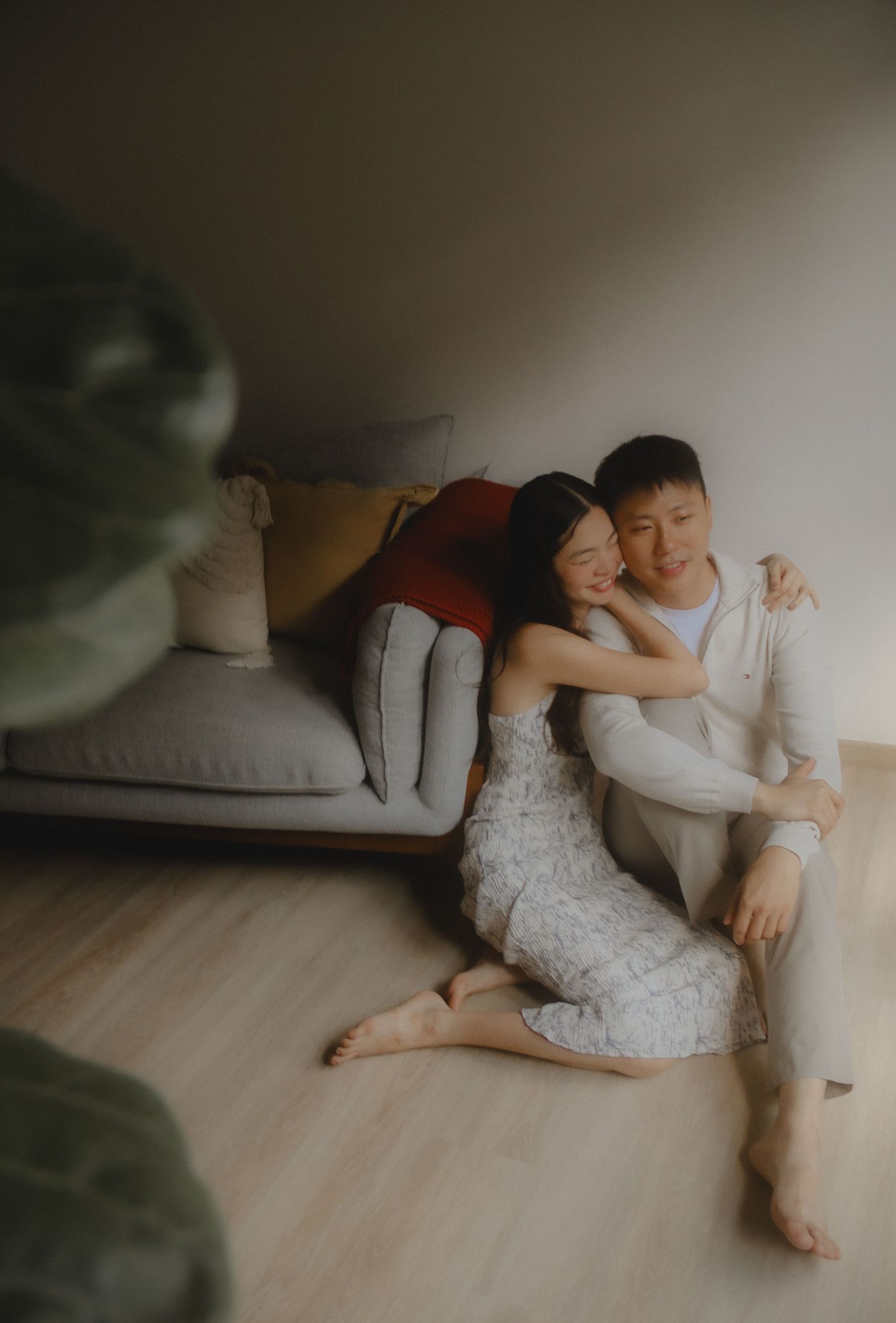 In-home couple photoshoot in Singapore with warm, natural light and storytelling focus