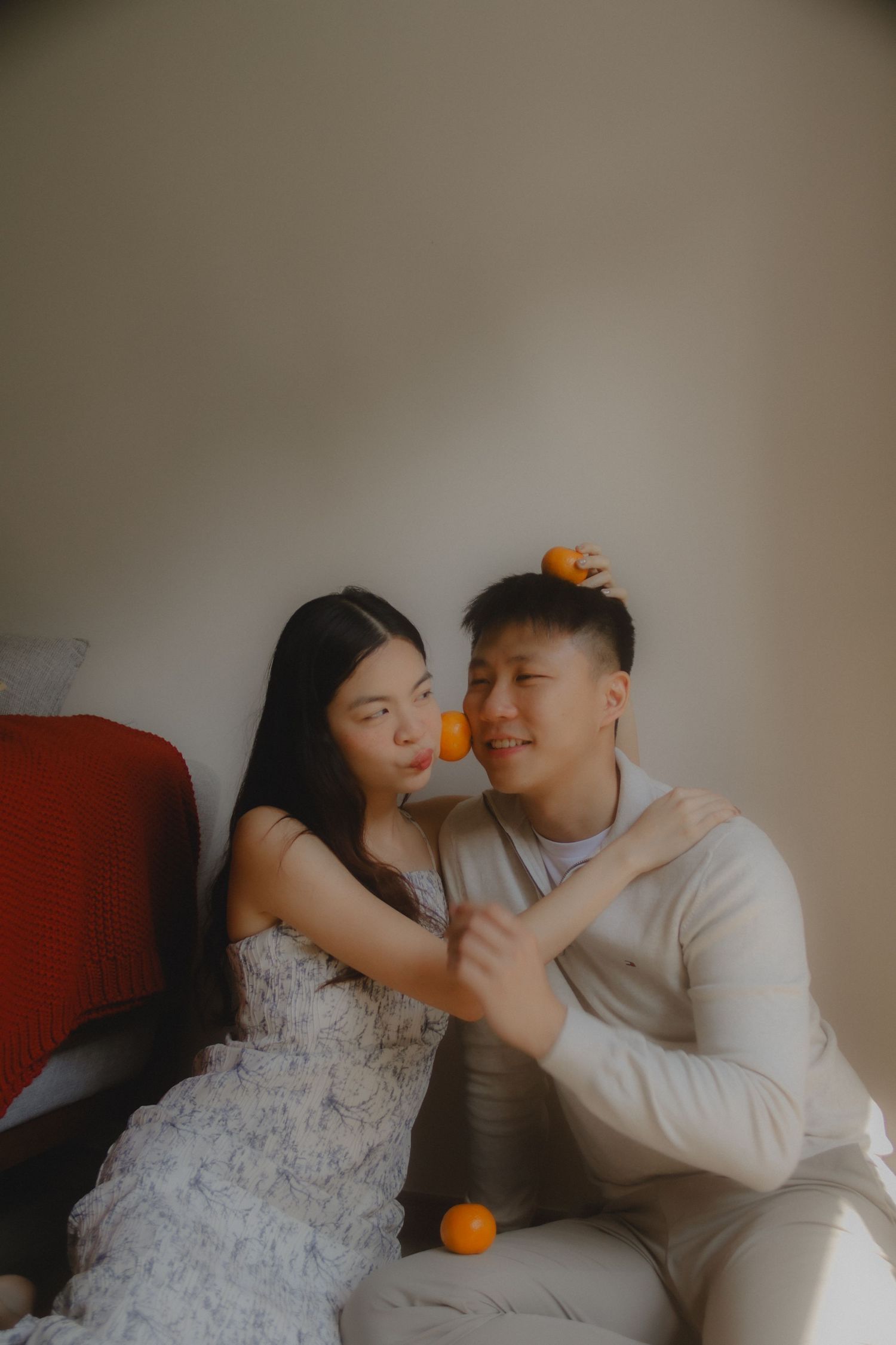 In-home couple photoshoot in Singapore with warm, natural light and storytelling focus