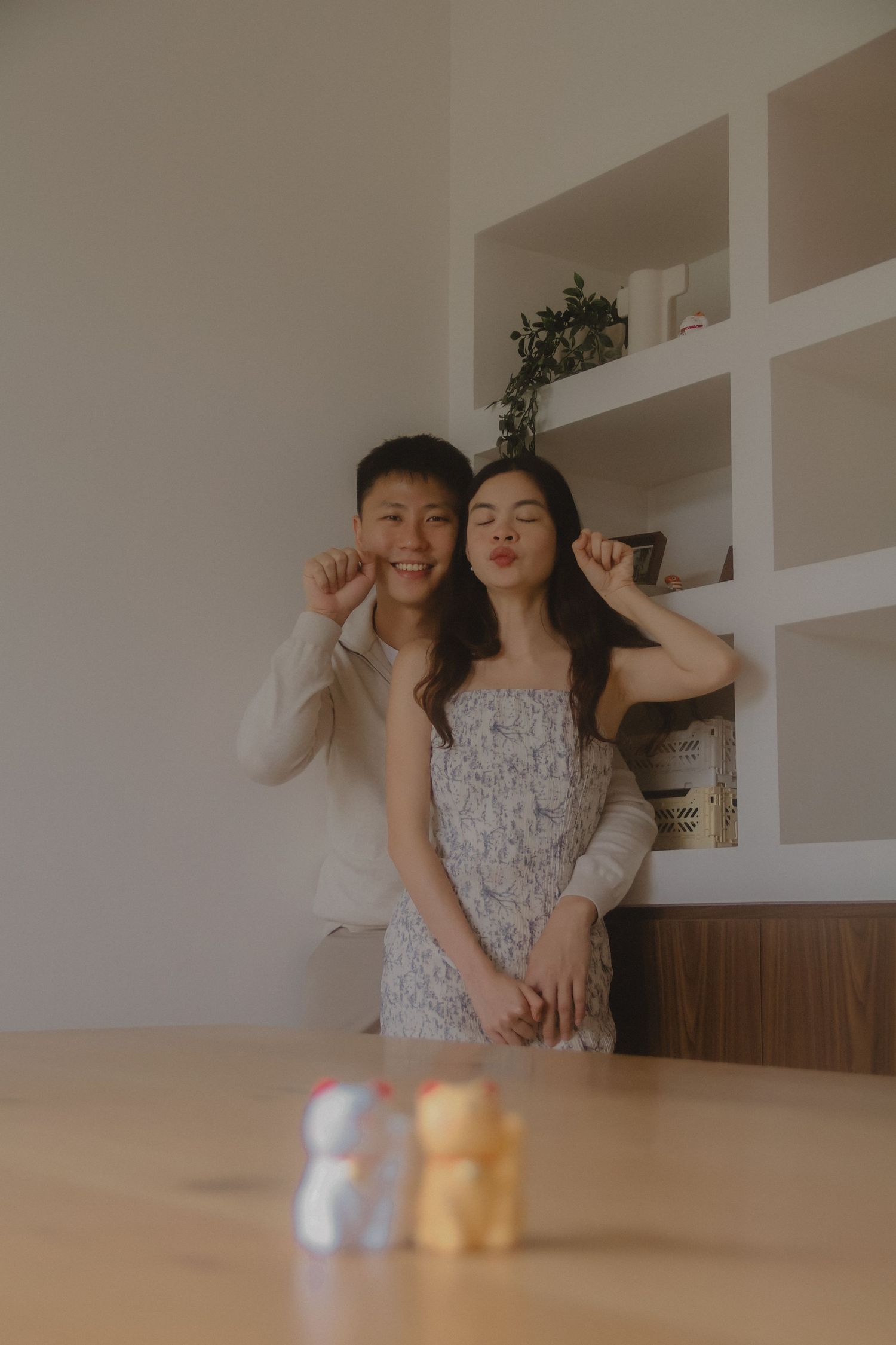 In-home couple photoshoot in Singapore with warm, natural light and storytelling focus