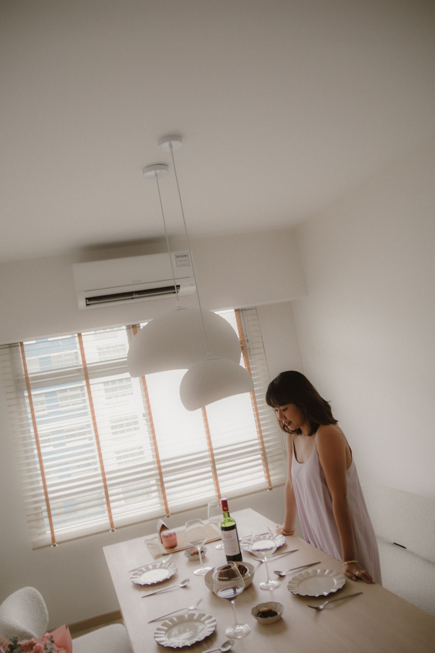 Lifestyle in-home portrait photoshoot in Singapore capturing a woman in a natural, candid moment at home
