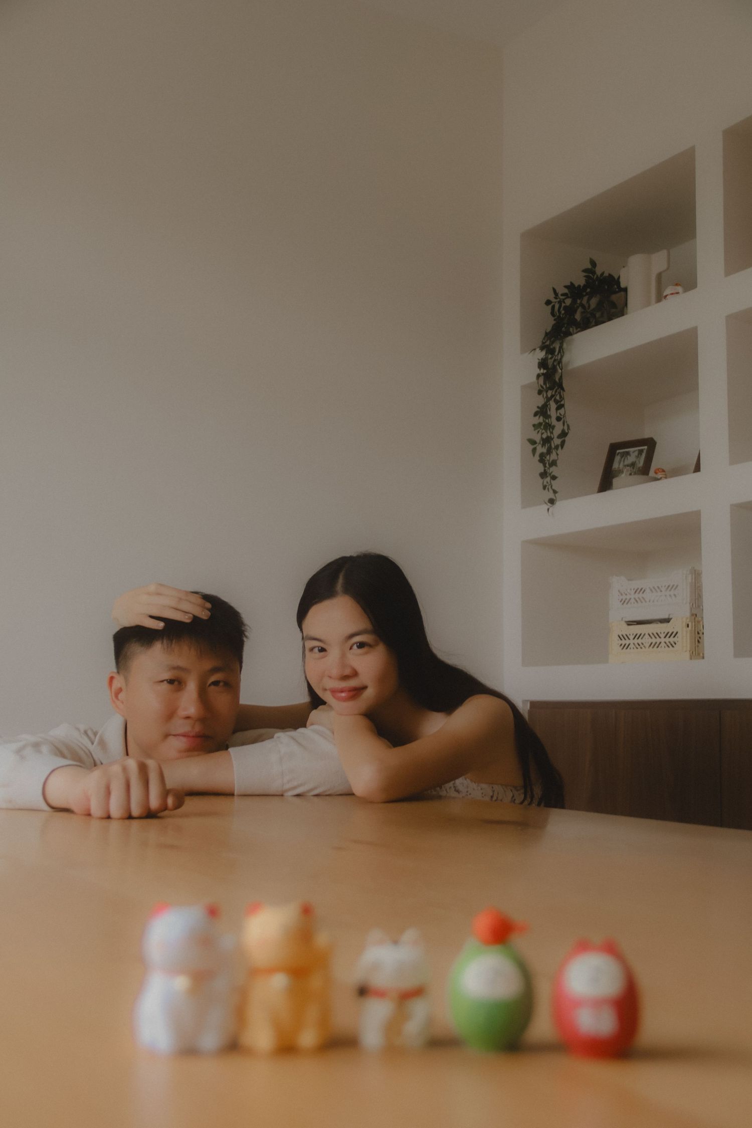 In-home couple photoshoot in Singapore with warm, natural light and storytelling focus