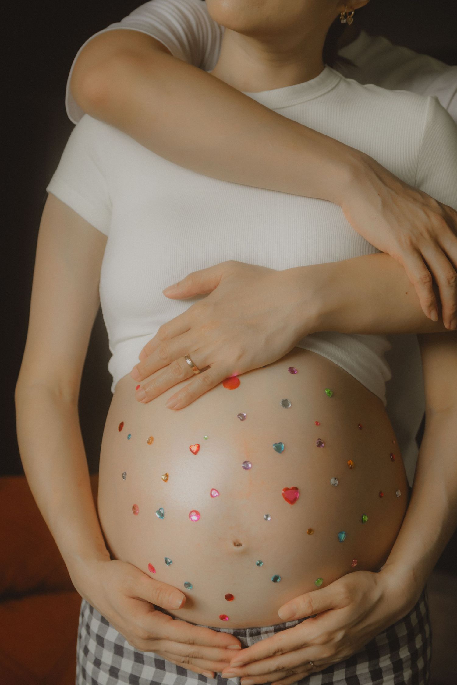 in-home maternity portrait photography in Singapore with natural light and emotional storytelling