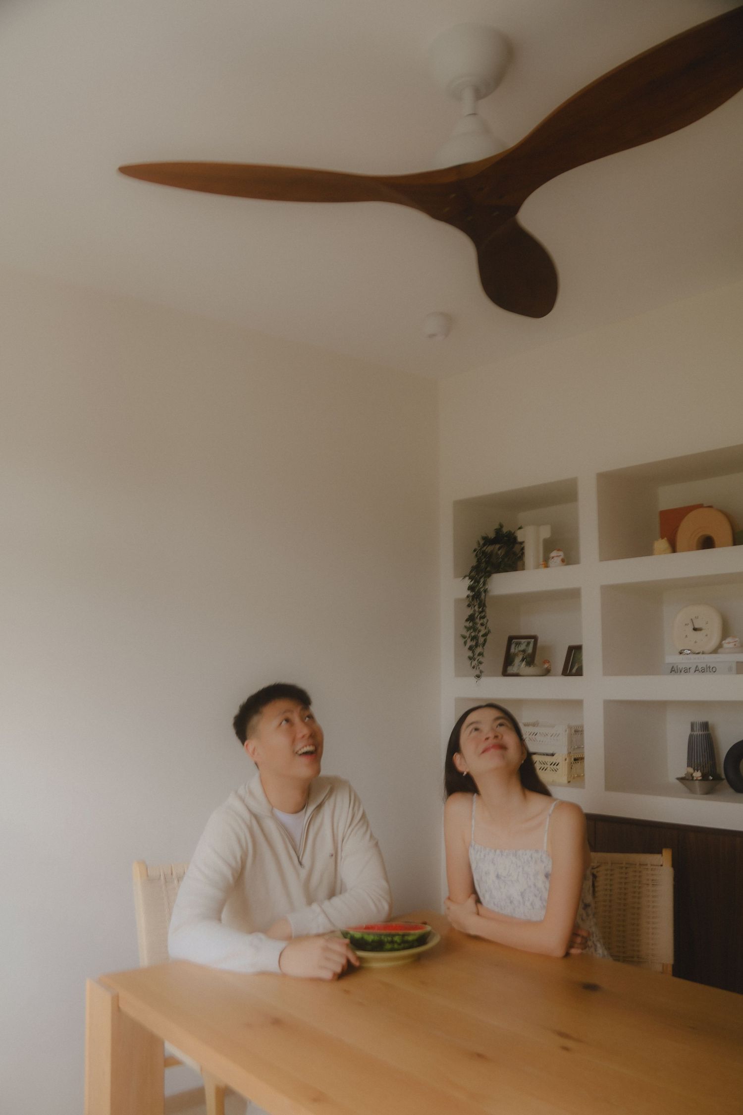 In-home couple photoshoot in Singapore with warm, natural light and storytelling focus