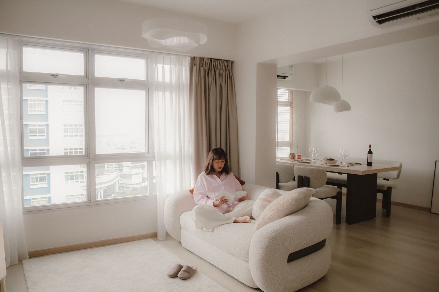 Lifestyle in-home portrait photoshoot in Singapore capturing a woman in a natural, candid moment at home
