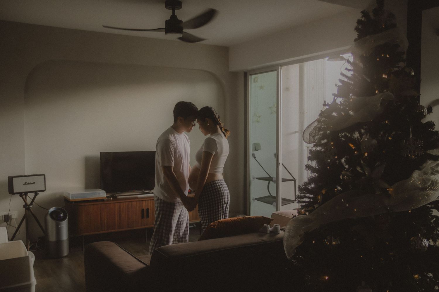 in-home maternity photography in Singapore with natural light and emotional storytelling