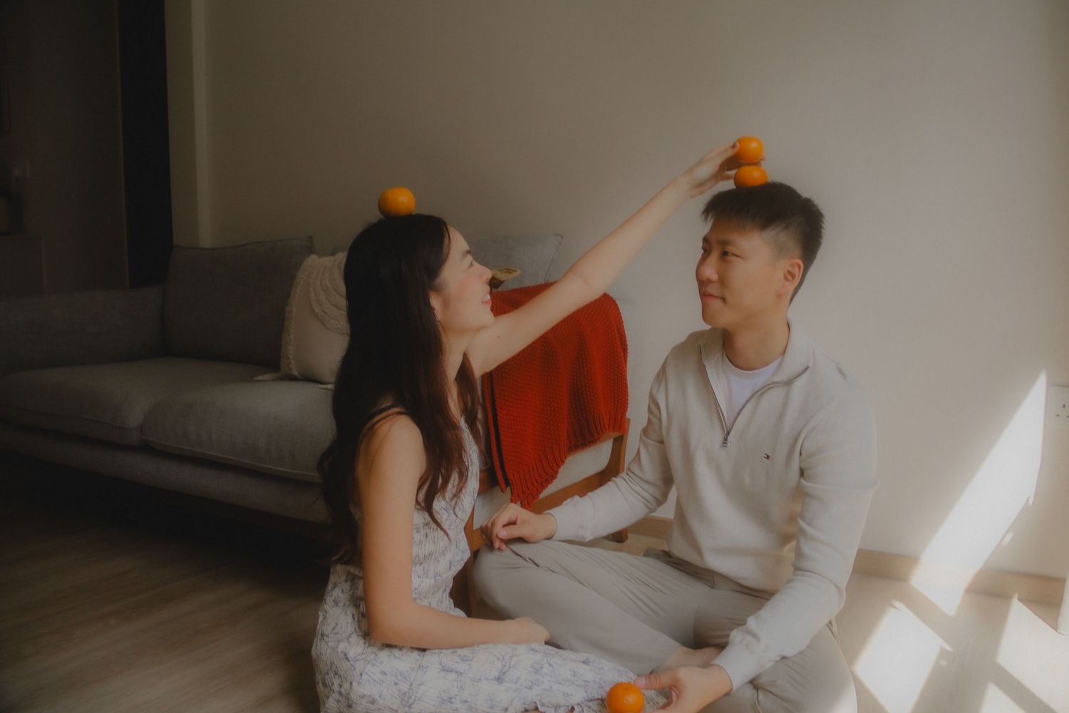 In-home couple photoshoot in Singapore with warm, natural light and storytelling focus