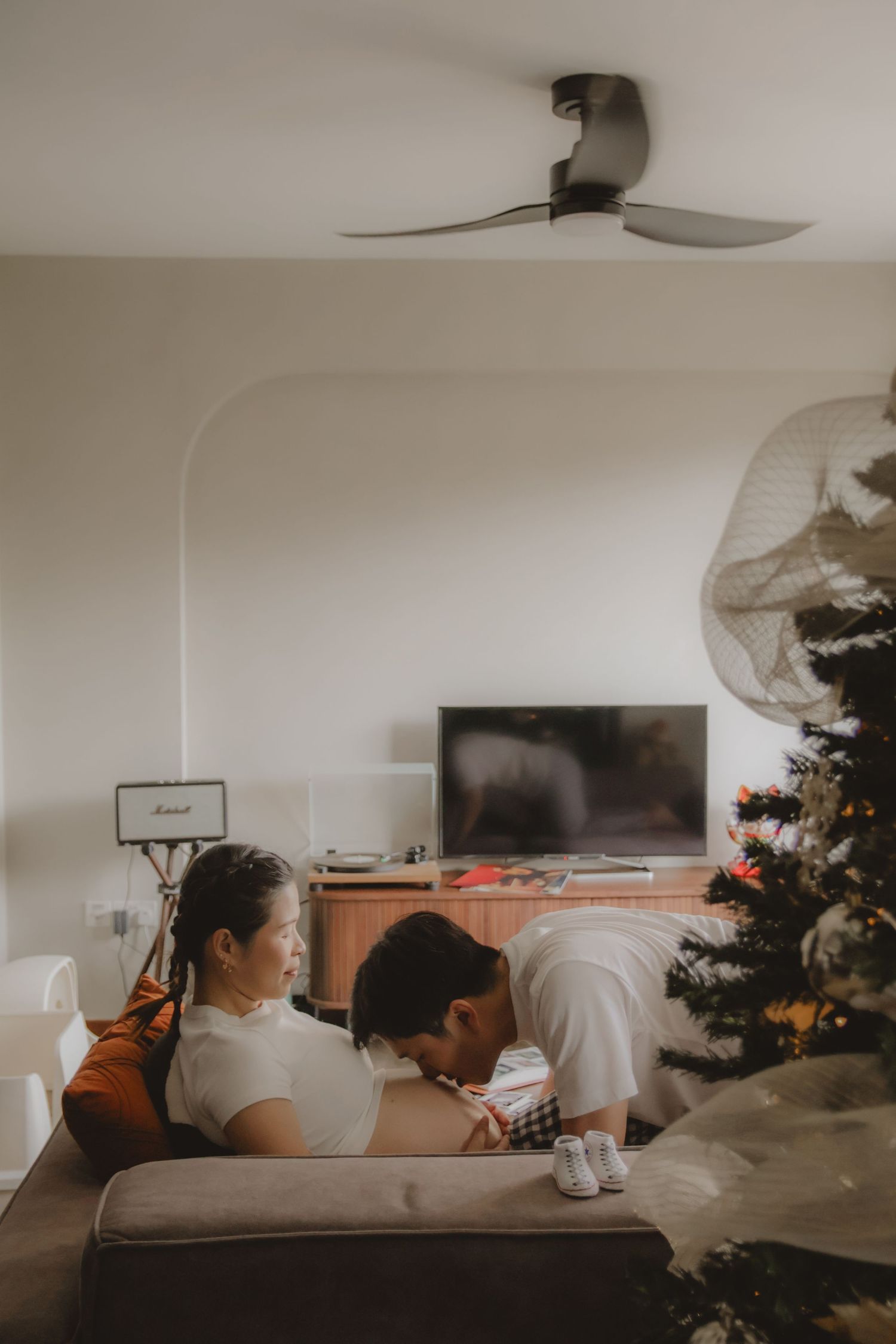 in-home maternity portrait photography in Singapore with natural light and emotional storytelling