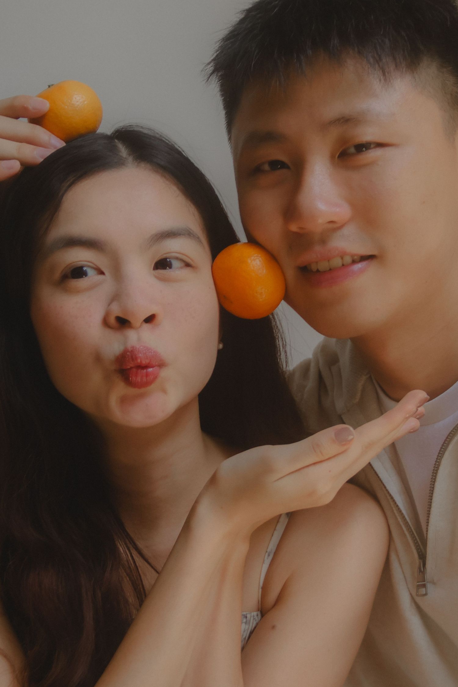 In-home couple photoshoot in Singapore with warm, natural light and storytelling focus