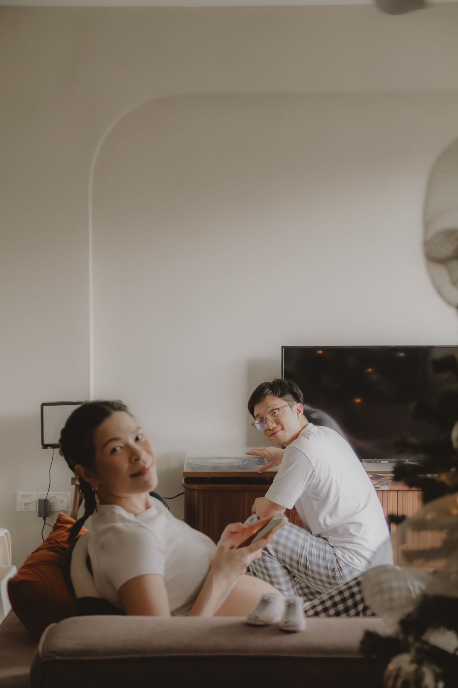 in-home maternity portrait photography in Singapore with natural light and emotional storytelling