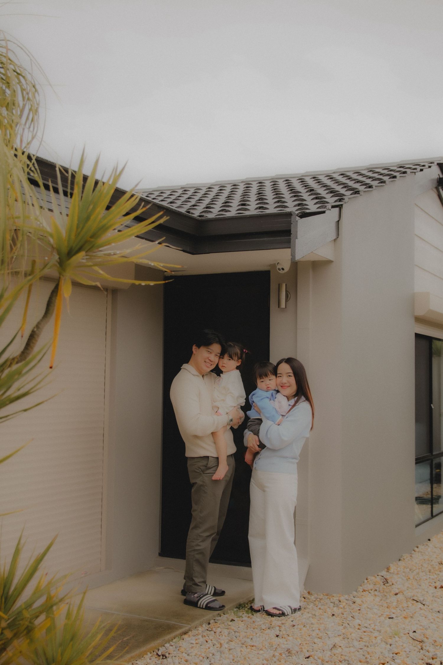 In-home family photoshoot in Singapore capturing candid moments between parents and children at home