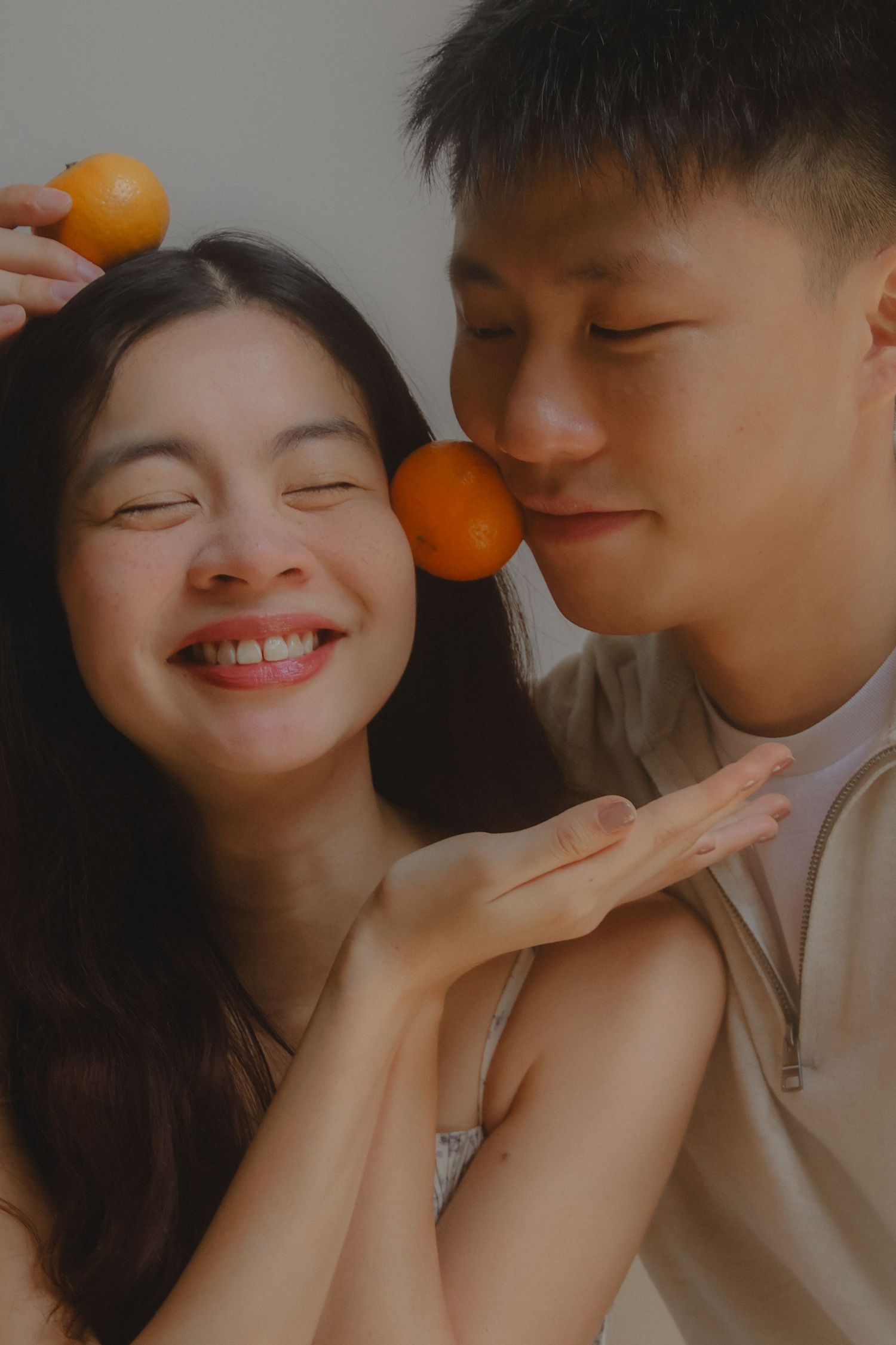 In-home couple photoshoot in Singapore with warm, natural light and storytelling focus