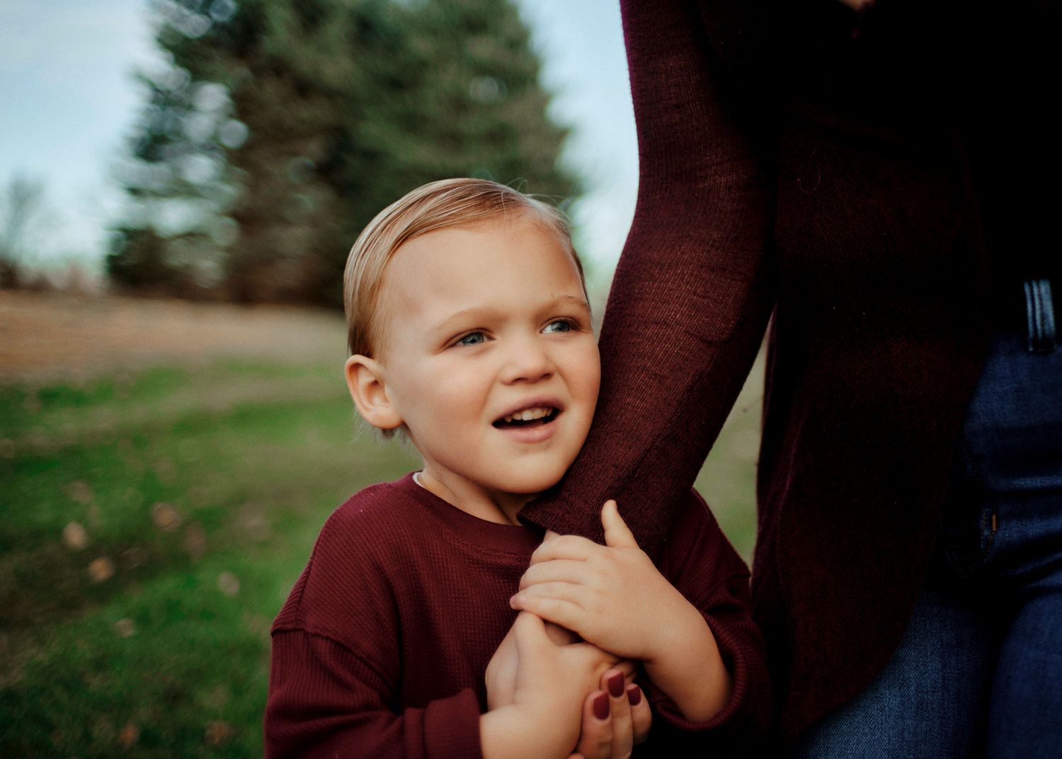 Candid moments captured in warm autumn lighting outdoors.