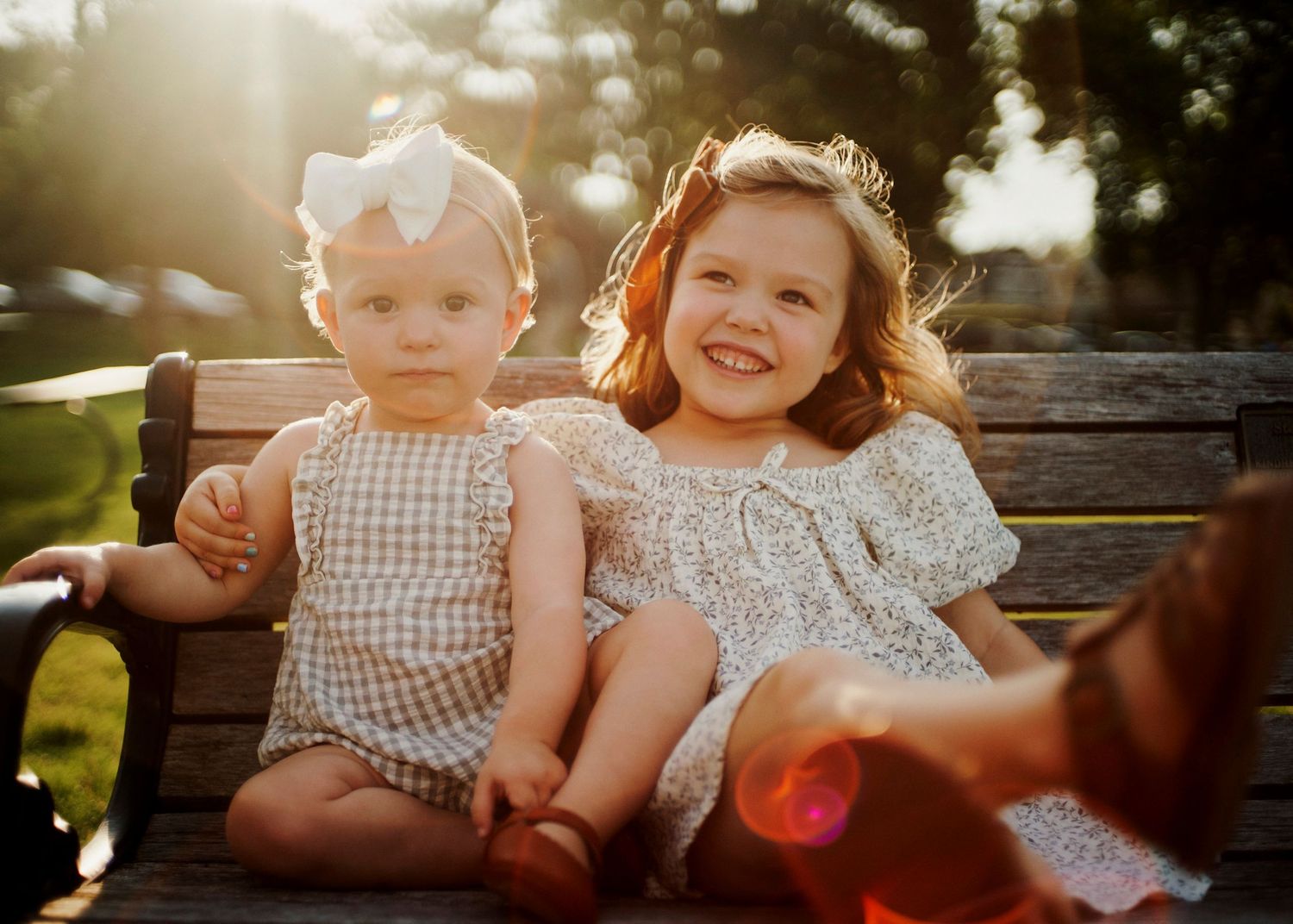 Sweet family interactions during a golden sunset photo session outdoors.