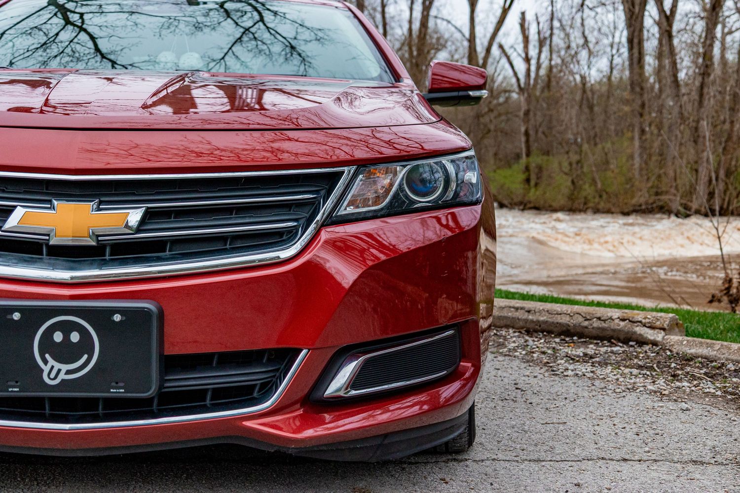 Detail shots of red and black Chevrolet vehicle front ends and grilles.