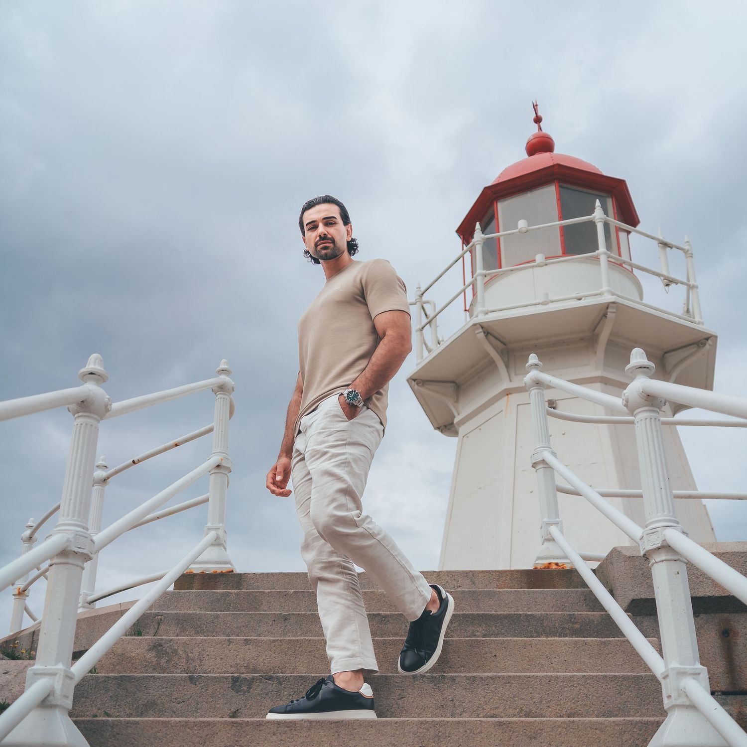Model Photography of a young man walking down a set of stairs. Captured by Photopazo, a photographer in Malmö, Sweden.
