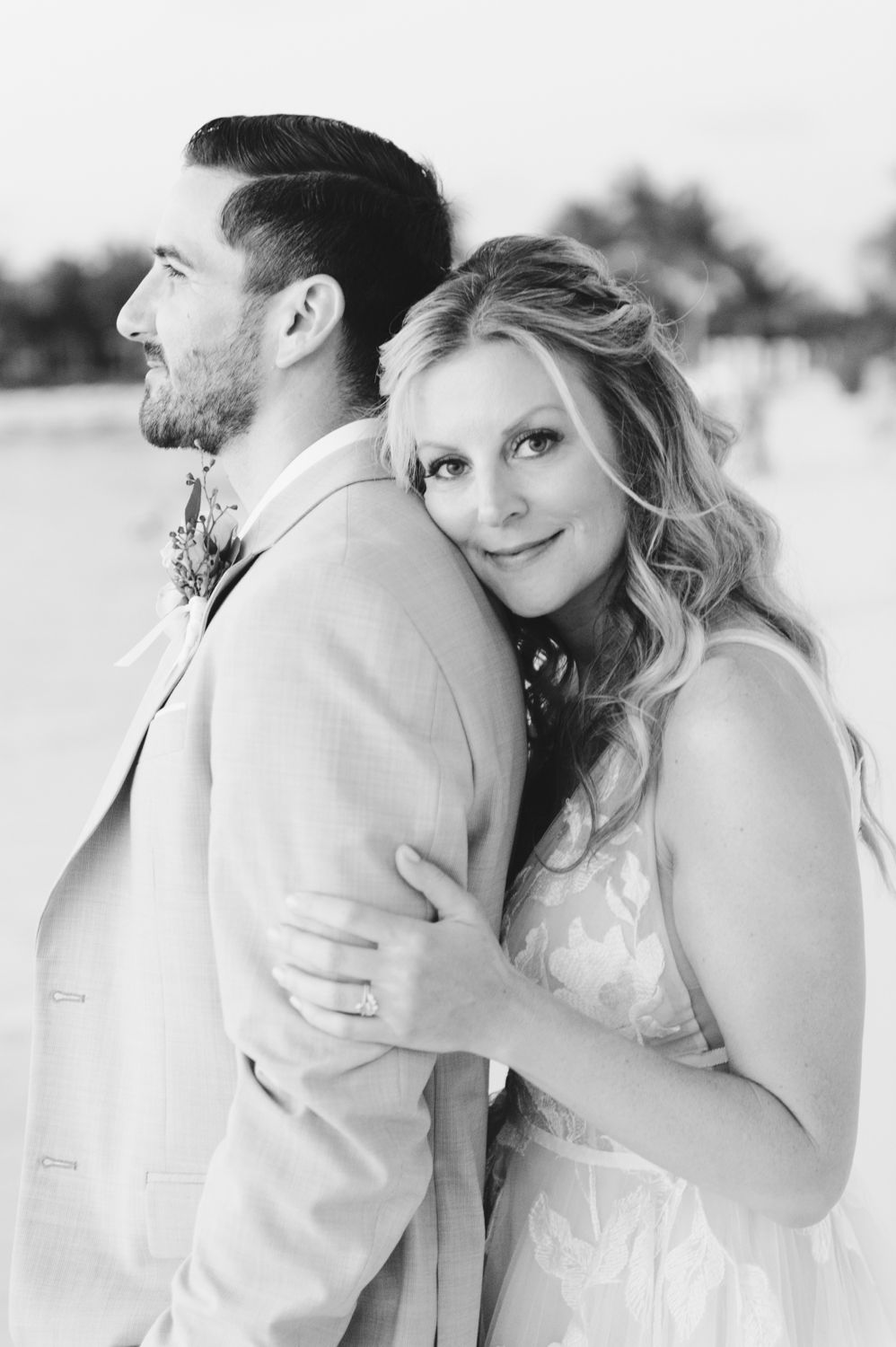 Black and white photo of wedding couple on beach in Caribbean. Rachel Mares Photography New Mexico and Destination Photographer