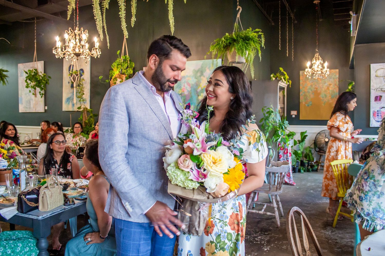 Toronto Event Photographer - A celebration at an indoor garden venue with elegant lighting and floral decorations.