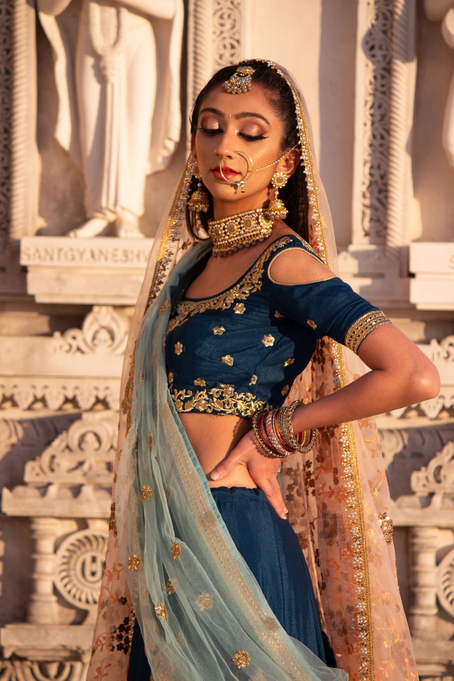 Toronto Portrait Photographer - Detailed shot of Indian bridal fashion with intricate embroidery and traditional jewelry.