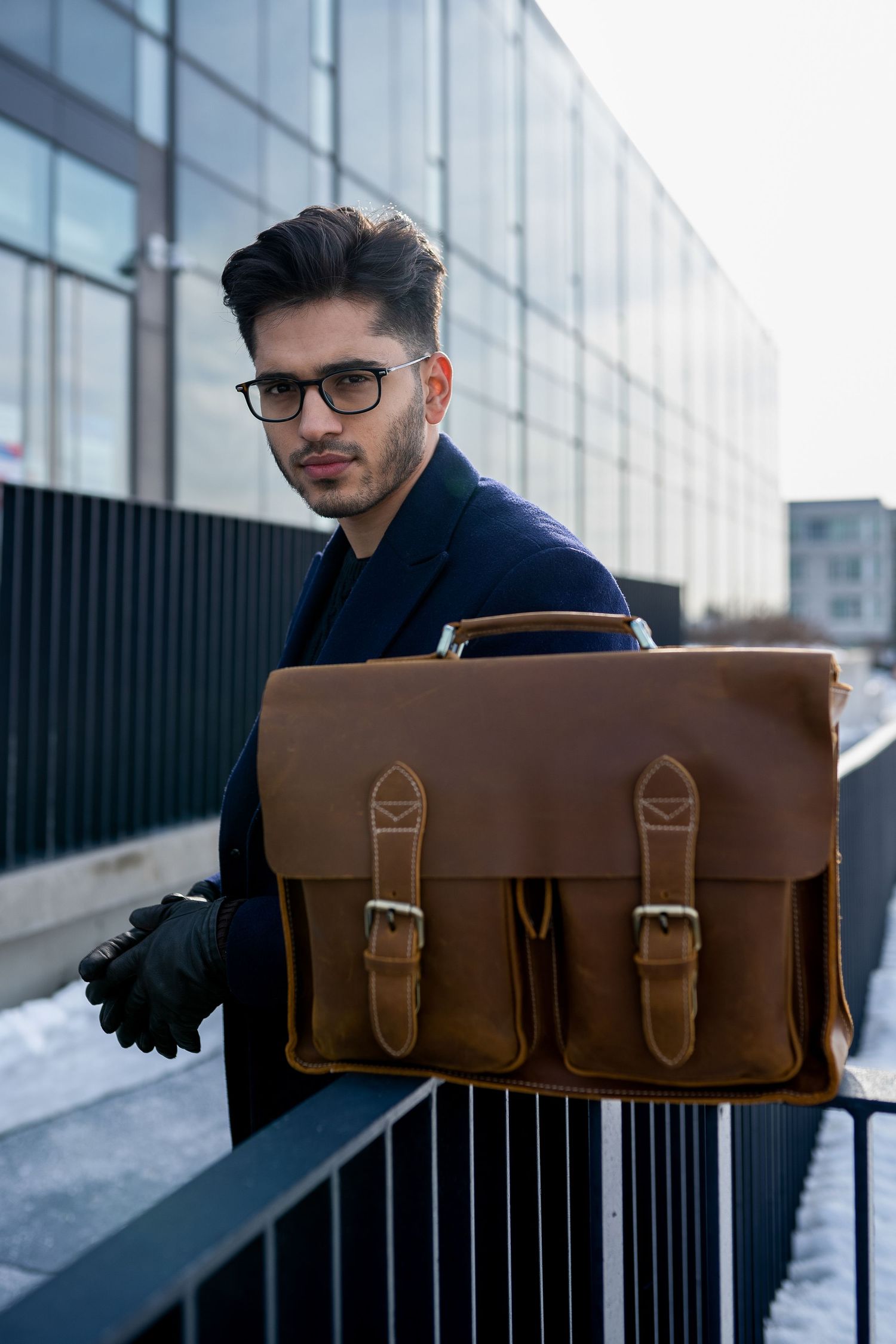 Toronto Portrait Photographer -  Professional style with vintage brown leather briefcase against modern architecture.