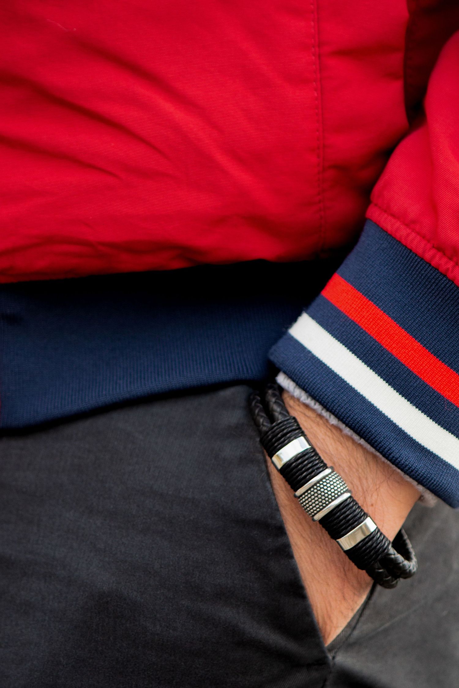 Toronto Product Photographer - Detail shot of red and navy striped clothing with bracelet accessories.
